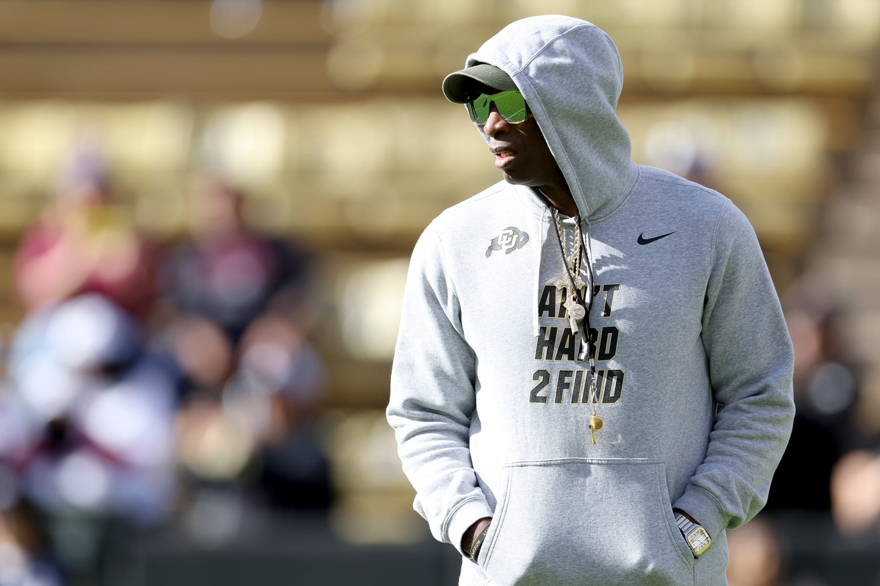 BOULDER, COLORADO - NOVEMBER 11: Head coach Deion Sanders of the Colorado Buffaloes watches as his team warms-up in pregame prior to playing the Arizona Wildcats at Folsom Field on November 11, 2023 in Boulder, Colorado. (Photo by Matthew Stockman/Getty Images)