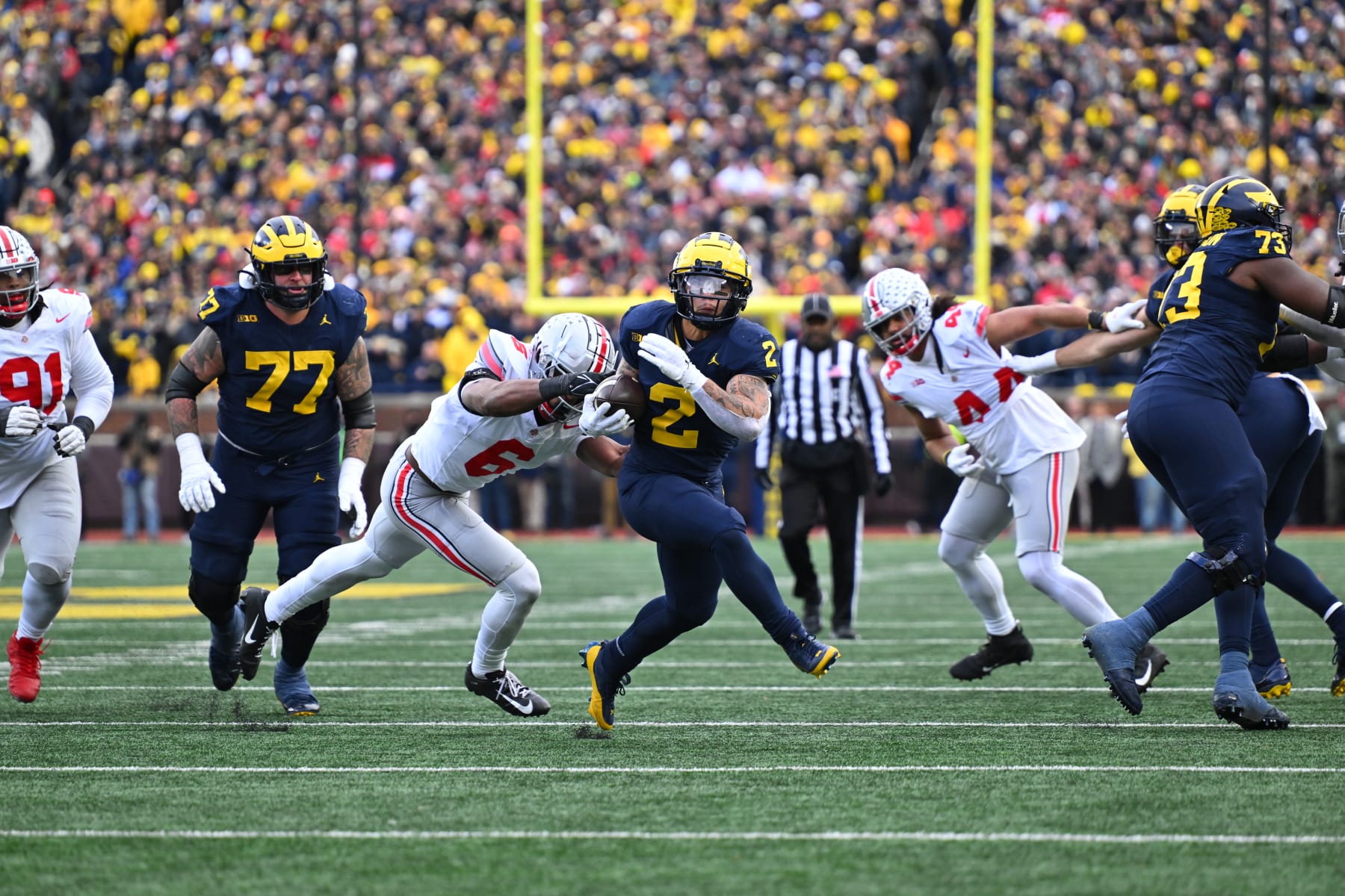 ANN ARBOR, MI - NOVEMBER 25: Michigan Wolverines running back Blake Corum (2) breaks free up the middle for a long touchdown run during the Michigan Wolverines versus the Ohio State Buckeyes on Saturday November 25, 2023 at Michigan Stadium in Ann Arbor, MI. (Photo by Steven King/Icon Sportswire via Getty Images) ANN ARBOR, MI - NOVEMBER 25: Michigan Wolverines running back Blake Corum (2) breaks free up the middle for a long touchdown run during the Michigan Wolverines versus the Ohio State Buckeyes on Saturday November 25, 2023 at Michigan Stadium in Ann Arbor, MI. (Photo by Steven King/Icon Sportswire via Getty Images)