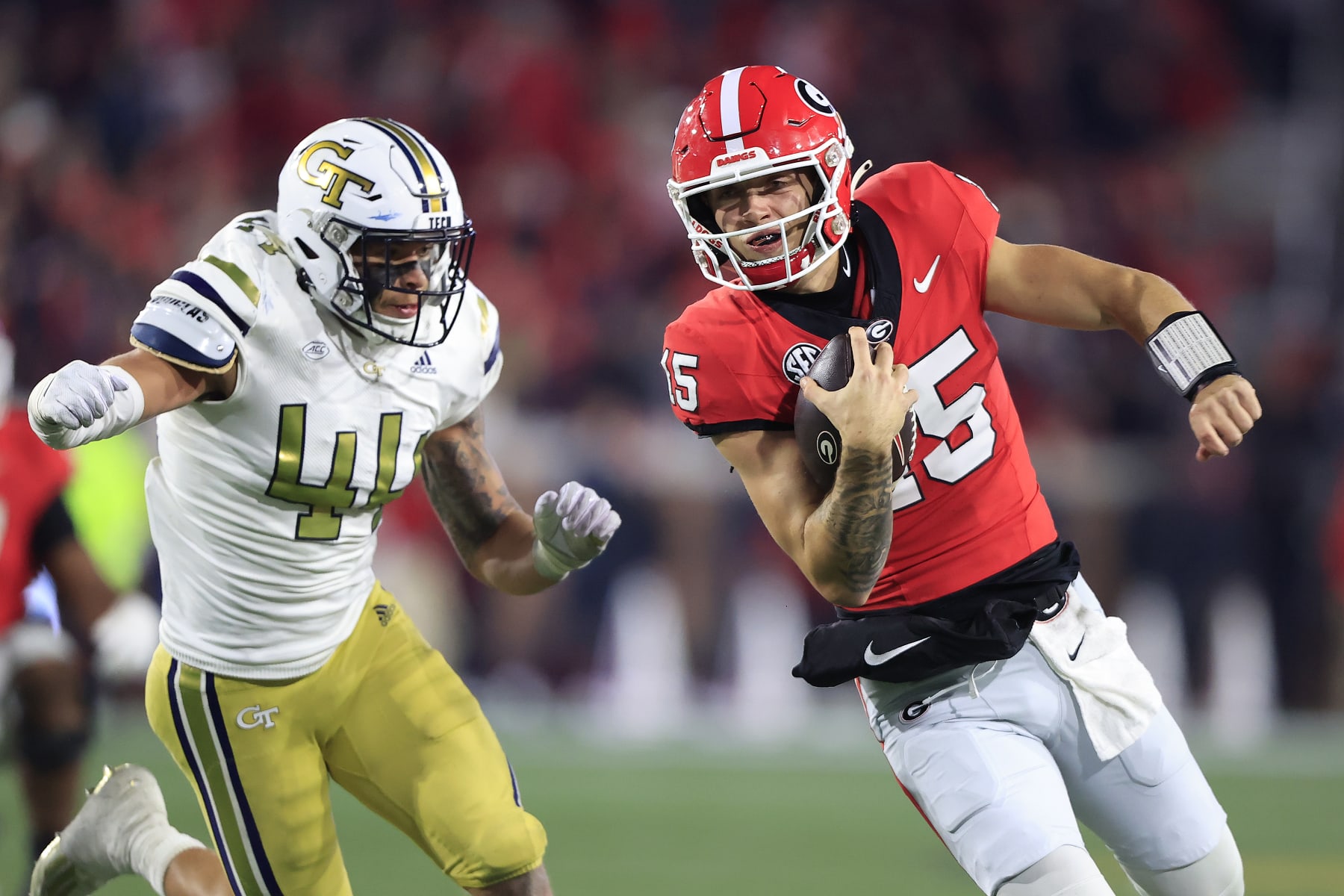 ATLANTA, GA - NOVEMBER 25: Georgia Bulldogs starting quarterback Carson Beck (15) avoids Georgia Tech Yellow Jackets linebacker Kyle Efford (44) during the Saturday evening college football game between the #1 ranked Georgia Bulldogs and the Georgia Tech Yellow Jackets on November 25, 2023 at Bobby Dodd Stadium in Atlanta, GA.  (Photo by David J. Griffin/Icon Sportswire via Getty Images)