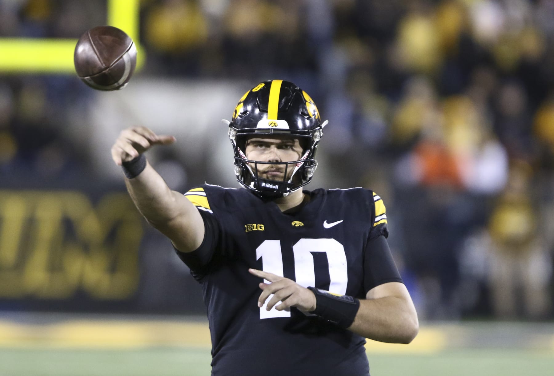 IOWA CITY, IOWA- NOVEMBER 18:  Quarterback Deacon Hill #10 of the Iowa Hawkeyes throws a pass to keep loose during the second half against the Illinois Fighting Illini at Kinnick Stadium on November 18, 2023 in Iowa City, Iowa.  (Photo by Matthew Holst/Getty Images)