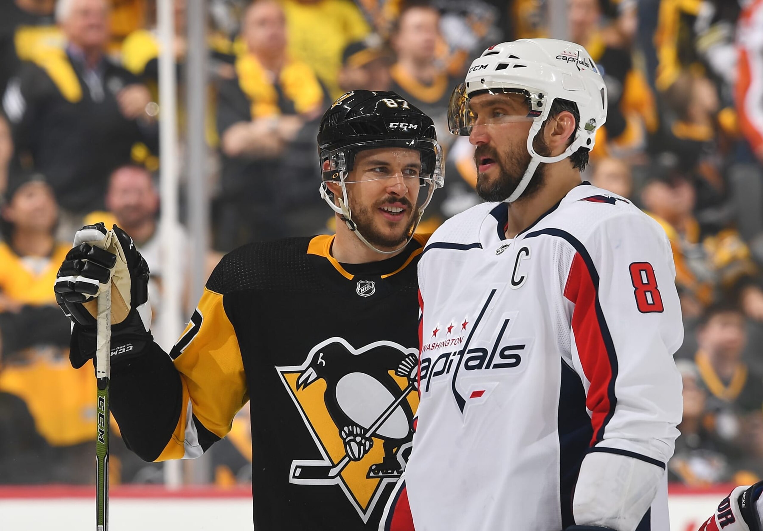 PITTSBURGH, PA - MAY 01:  Sidney Crosby #87 of the Pittsburgh Penguins looks on alongside Alex Ovechkin #8 of the Washington Capitals in Game Three of the Eastern Conference Second Round during the 2018 NHL Stanley Cup Playoffs at PPG Paints Arena on May 1, 2018 in Pittsburgh, Pennsylvania.  (Photo by Joe Sargent/NHLI via Getty Images) *** Local Caption ***