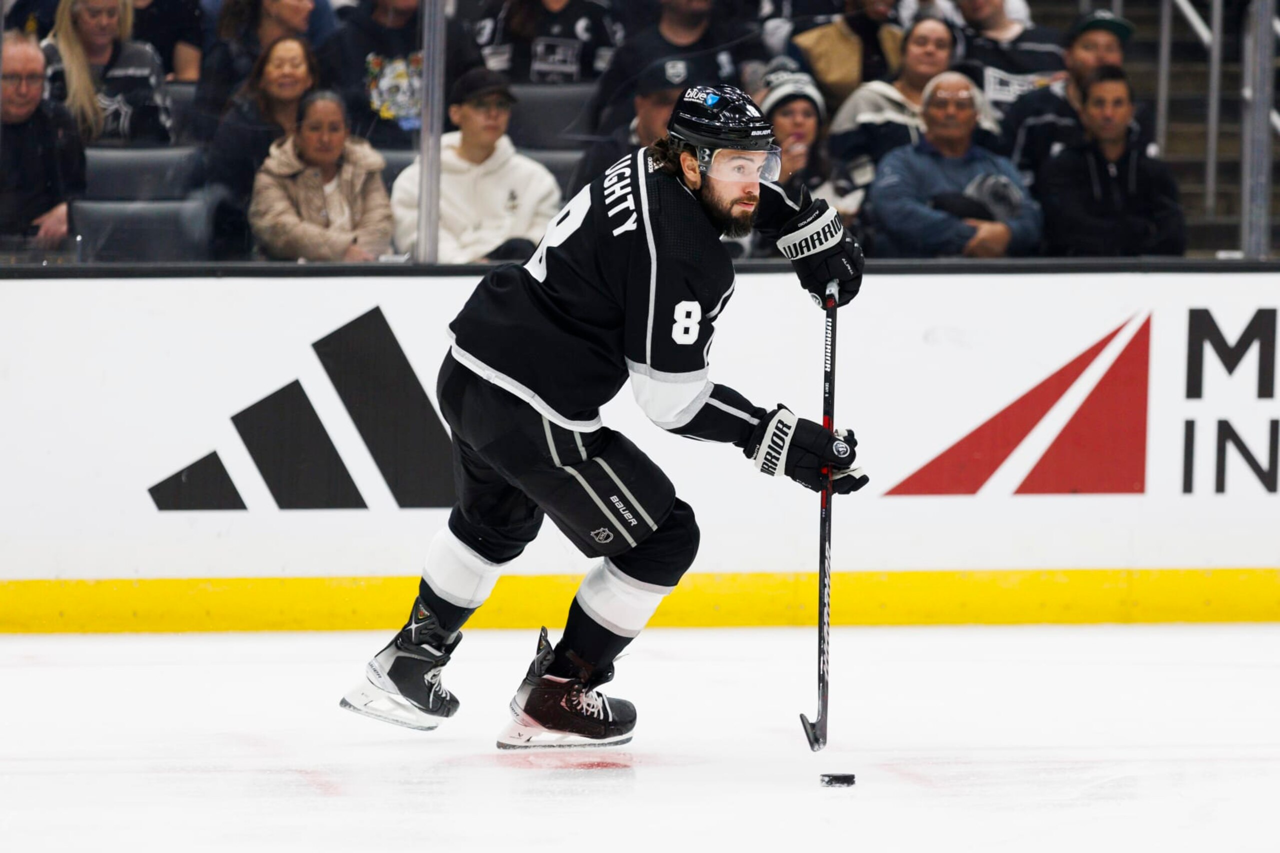 LOS ANGELES, CA - NOVEMBER 09: Los Angeles Kings defenseman Drew Doughty (8) skates with the puck during an NHL hockey game against the Pittsburgh Penguins on November 9, 2023 at Crypto.com Arena in Los Angeles, CA. (Photo by Ric Tapia/Icon Sportswire via Getty Images)