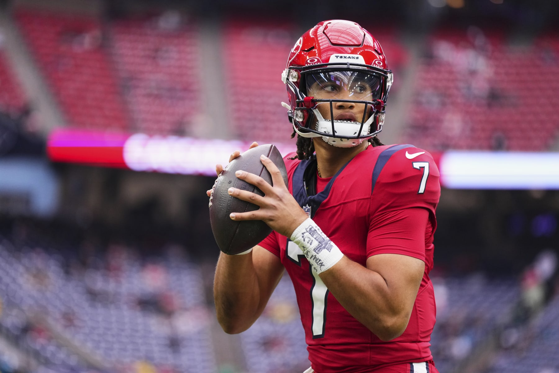 HOUSTON, TX - NOVEMBER 26: C.J. Stroud #7 of the Houston Texans warms up before kickoff against the Jacksonville Jaguars at NRG Stadium on November 26, 2023 in Houston, Texas. (Photo by Cooper Neill/Getty Images)