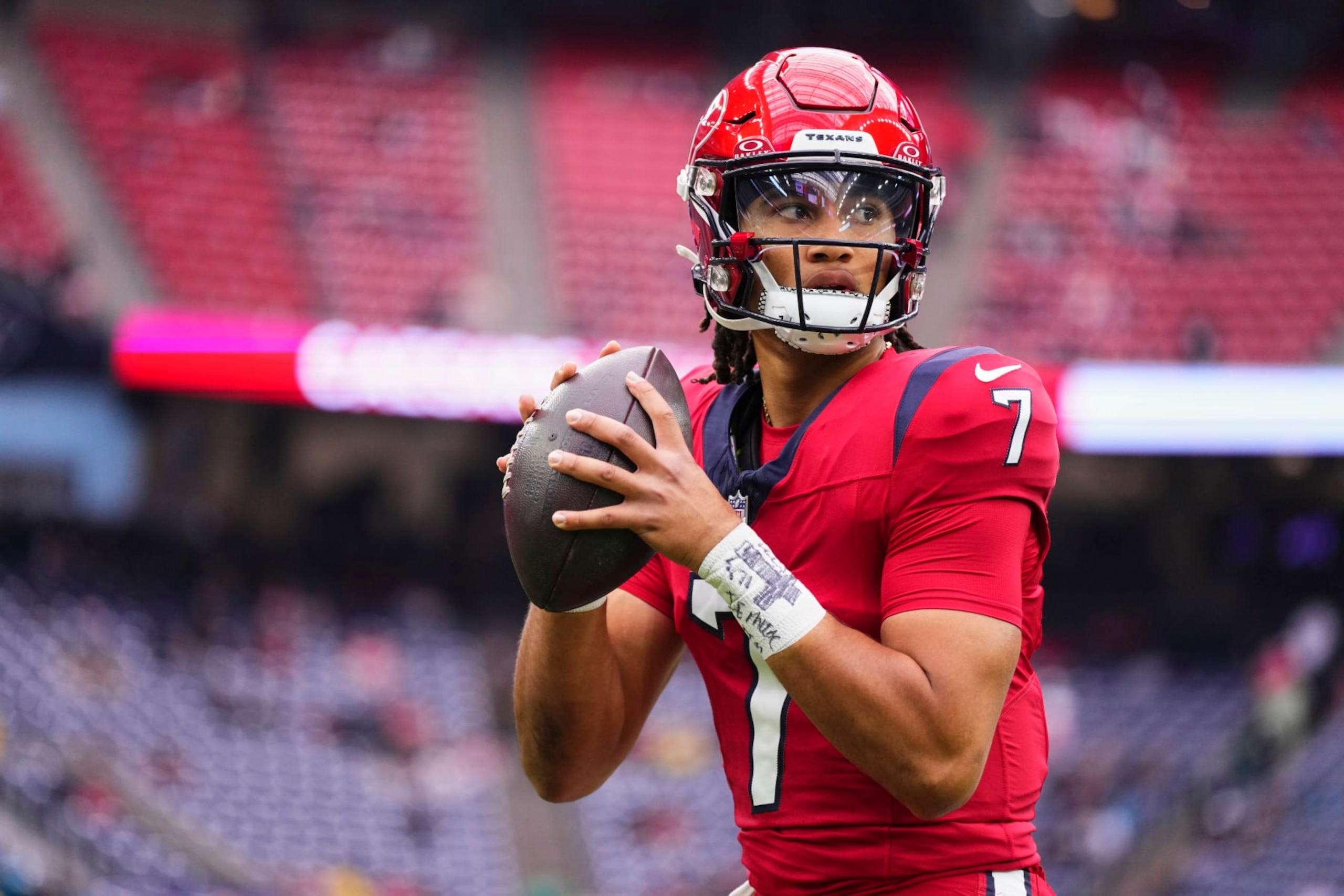 HOUSTON, TX - NOVEMBER 26: C.J. Stroud #7 of the Houston Texans warms up before kickoff against the Jacksonville Jaguars at NRG Stadium on November 26, 2023 in Houston, Texas. (Photo by Cooper Neill/Getty Images)