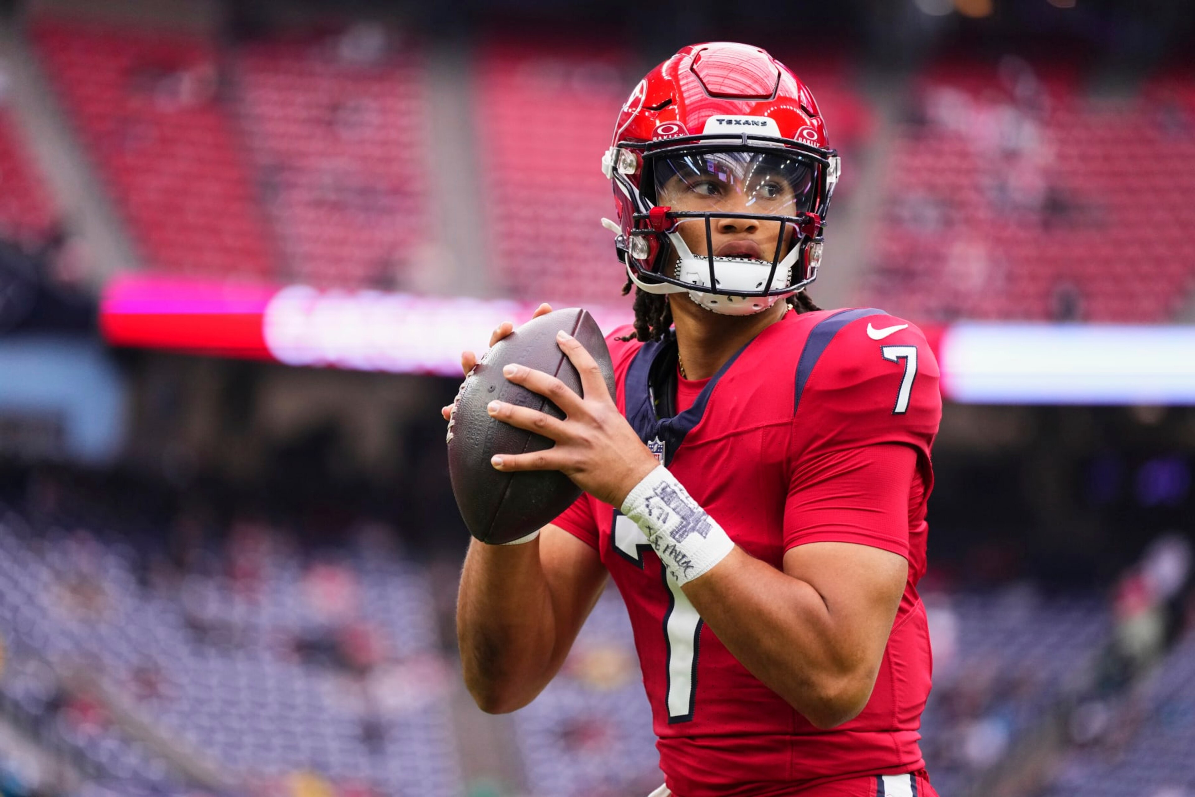 HOUSTON, TX - NOVEMBER 26: C.J. Stroud #7 of the Houston Texans warms up before kickoff against the Jacksonville Jaguars at NRG Stadium on November 26, 2023 in Houston, Texas. (Photo by Cooper Neill/Getty Images)