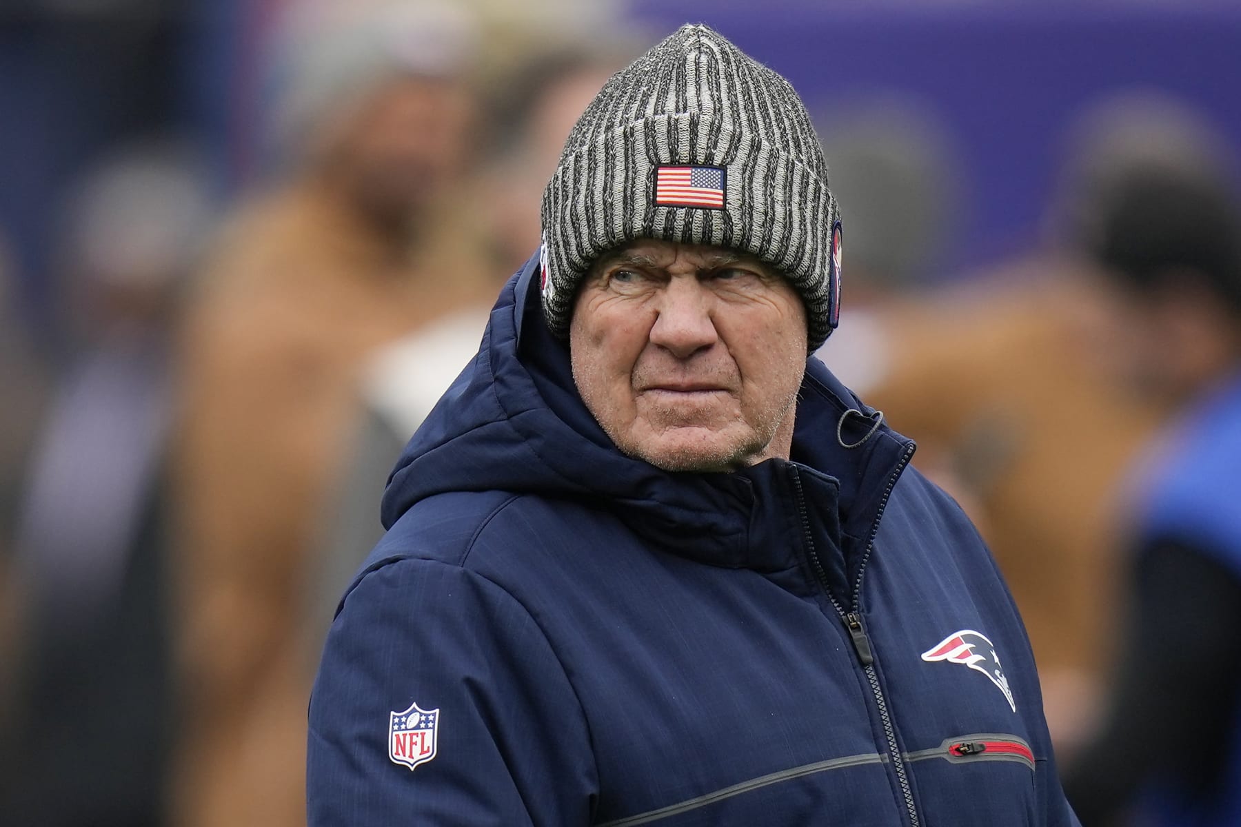New England Patriots head coach Bill Belichick walks on the field before an NFL football game against the New York Giants, Sunday, Nov. 26, 2023, in East Rutherford, N.J. (AP Photo/Seth Wenig)