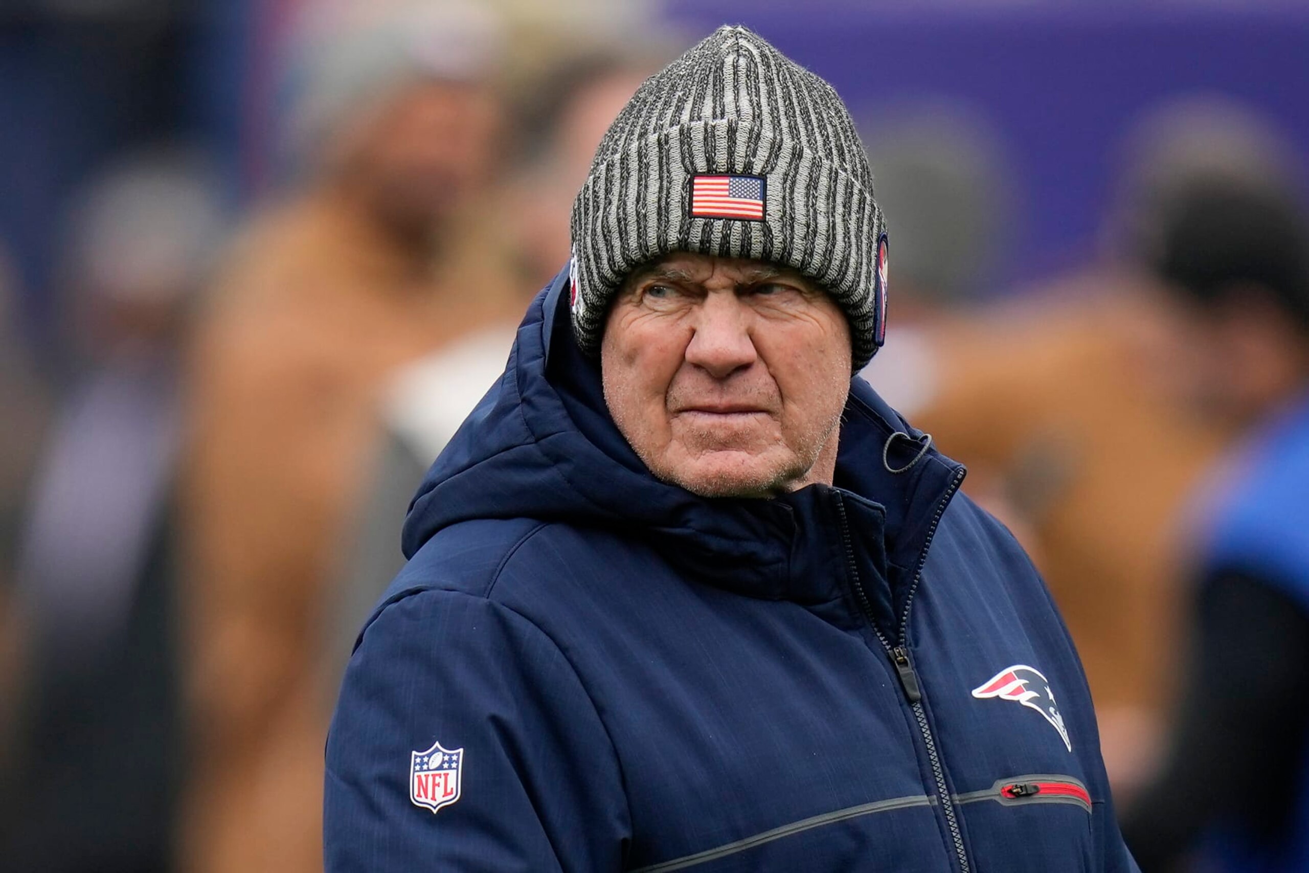 New England Patriots head coach Bill Belichick walks on the field before an NFL football game against the New York Giants, Sunday, Nov. 26, 2023, in East Rutherford, N.J. (AP Photo/Seth Wenig)