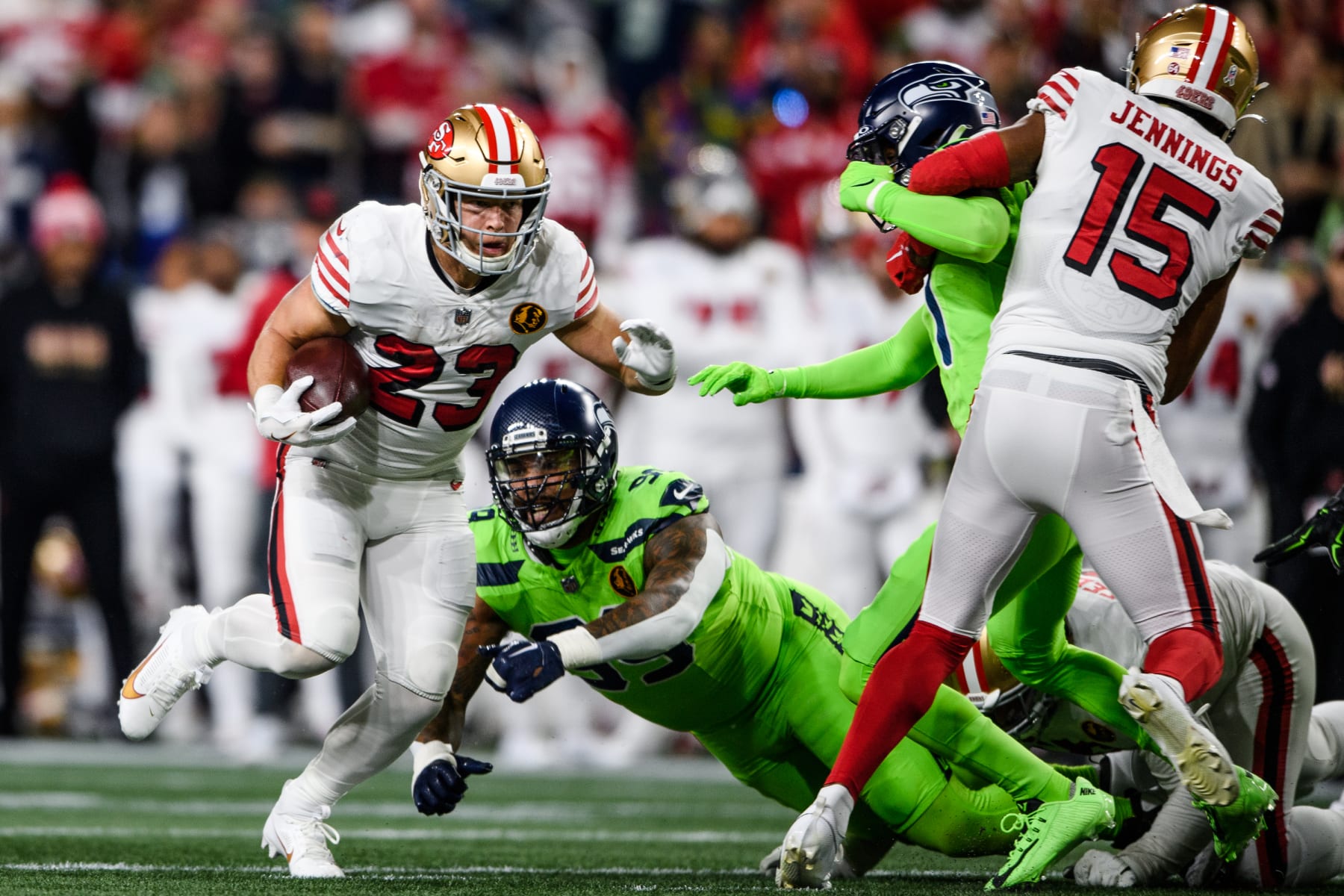 SEATTLE, WASHINGTON - NOVEMBER 23: San Francisco 49ers running back Christian McCaffrey #23 carries the ball during the first quarter of the game against the Seattle Seahawks at Lumen Field on November 23, 2023 in Seattle, Washington. (Photo by Jane Gershovich/Getty Images)