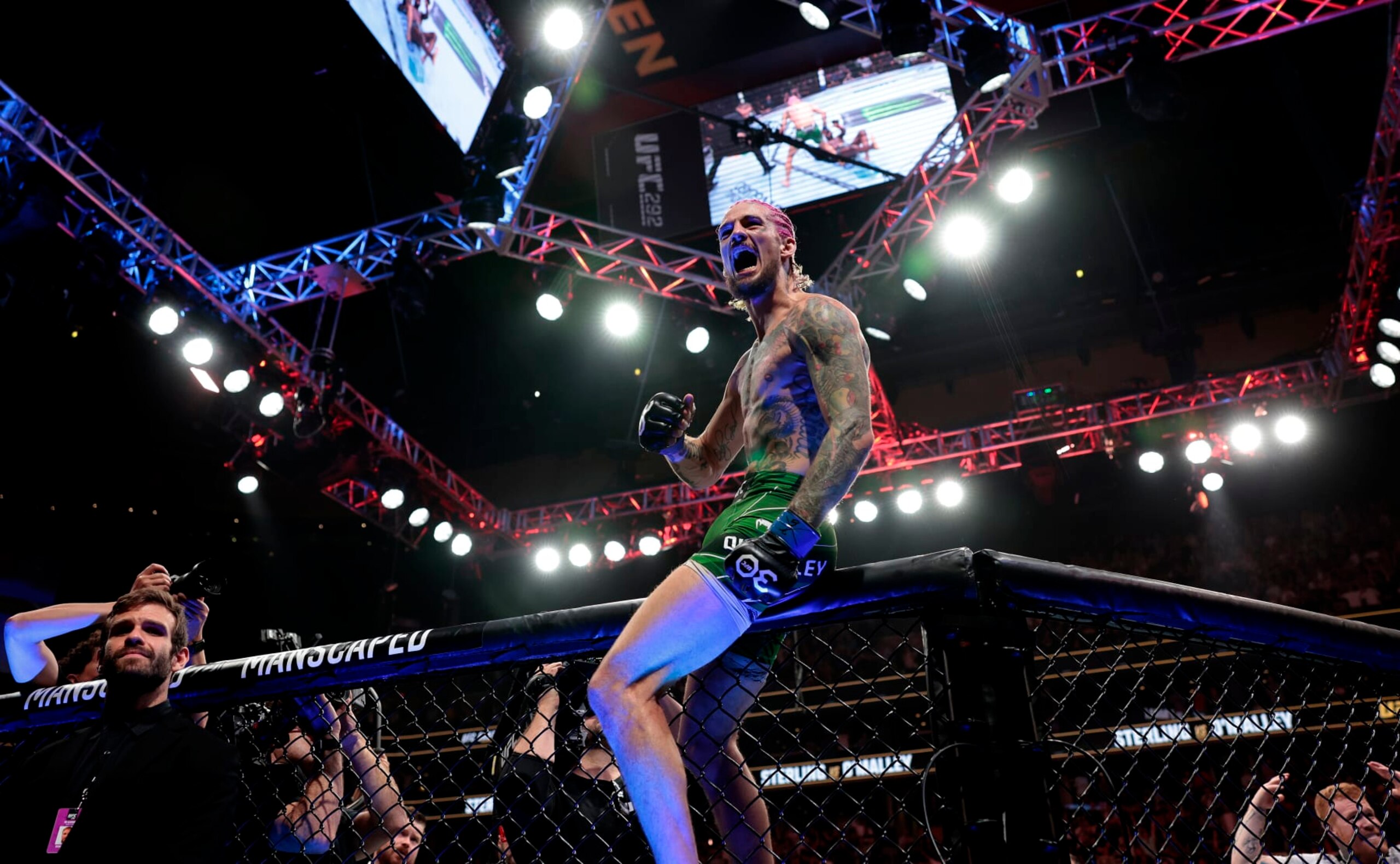 Sean O'Malley celebrates after he defeats Aljamain Sterling by TKO for the bantamweight title