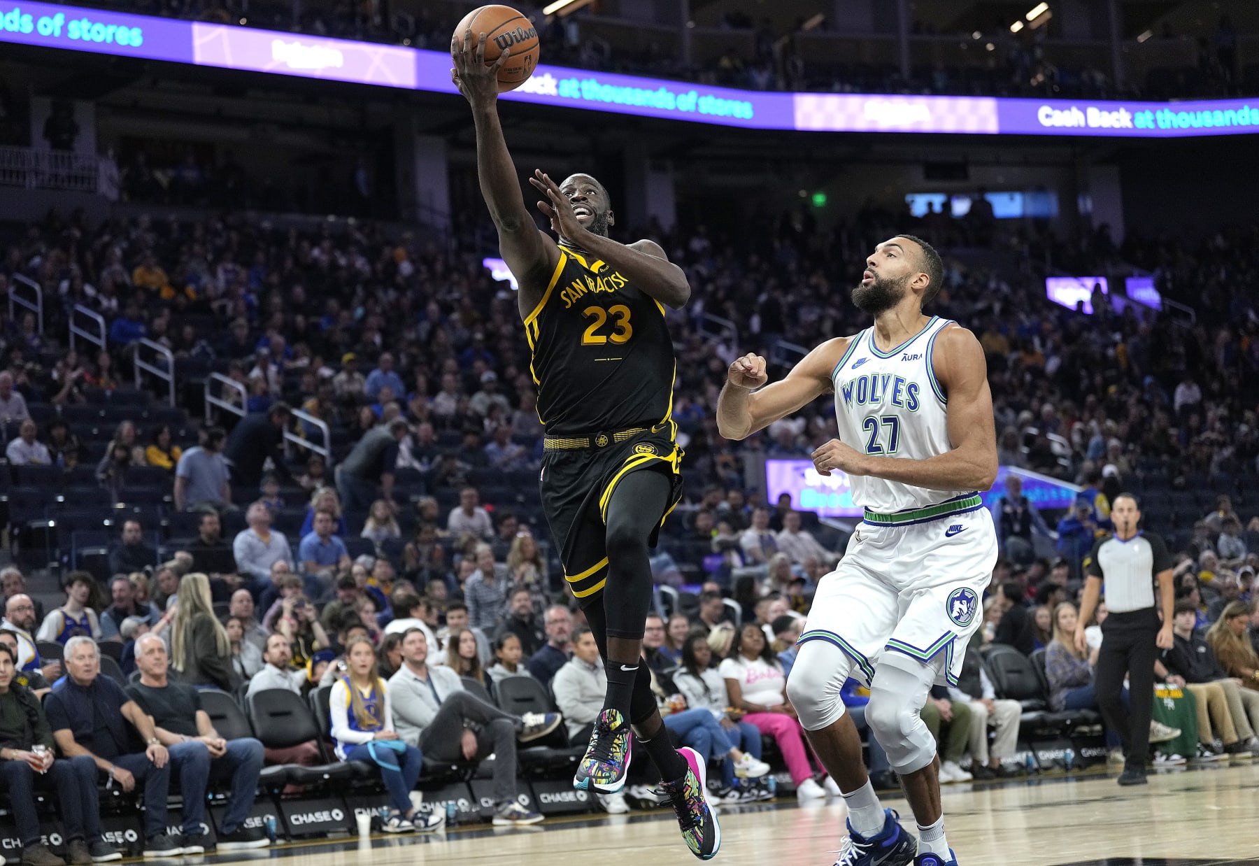 SAN FRANCISCO, CALIFORNIA - NOVEMBER 12: Draymond Green #23 of the Golden State Warriors shoots over Rudy Gobert #27 of the Minnesota Timberwolves during the second half of an NBA basketball game at Chase Center on November 12, 2023 in San Francisco, California. NOTE TO USER: User expressly acknowledges and agrees that, by downloading and or using this photograph, User is consenting to the terms and conditions of the Getty Images License Agreement. (Photo by Thearon W. Henderson/Getty Images)