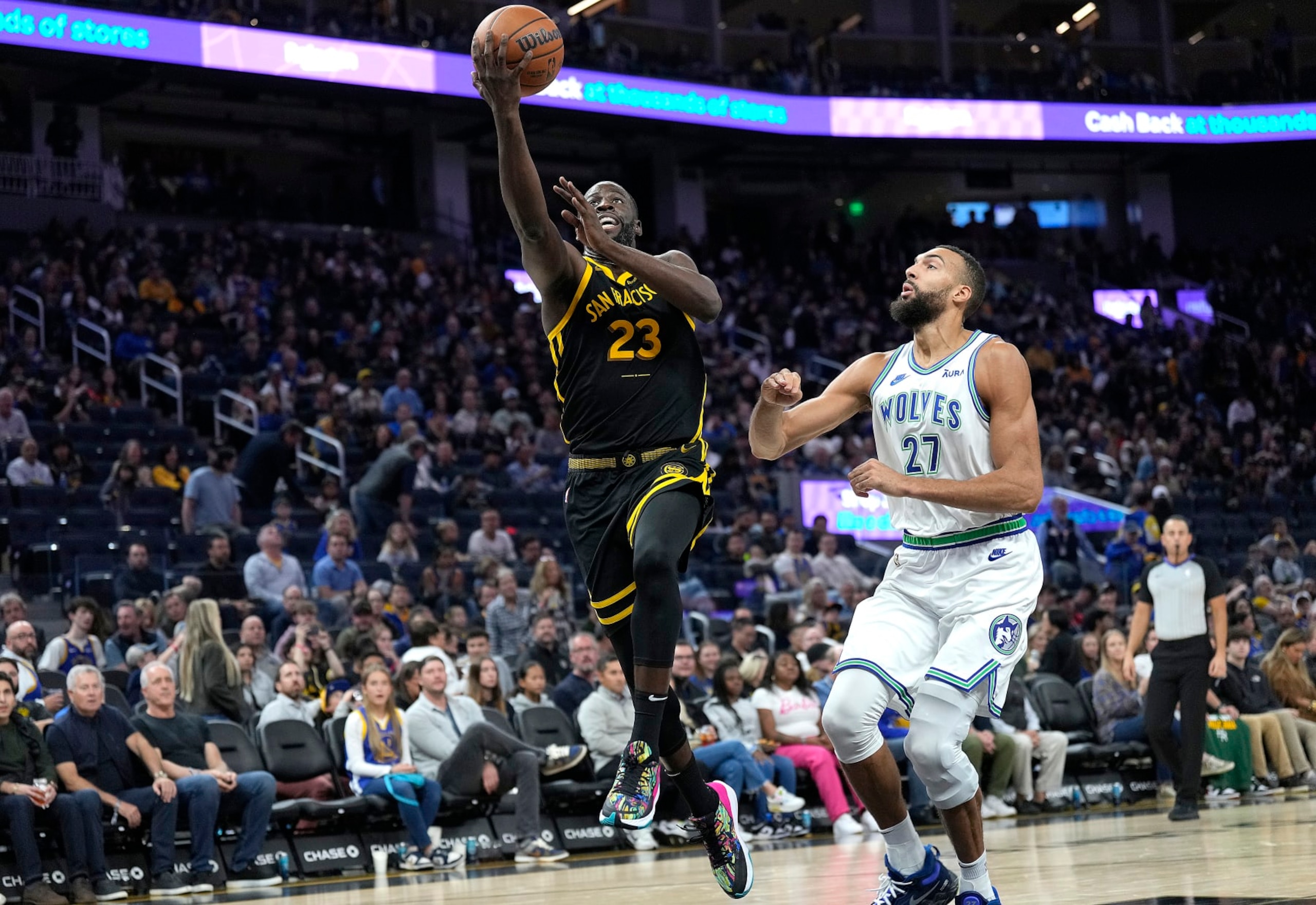 SAN FRANCISCO, CALIFORNIA - NOVEMBER 12: Draymond Green #23 of the Golden State Warriors shoots over Rudy Gobert #27 of the Minnesota Timberwolves during the second half of an NBA basketball game at Chase Center on November 12, 2023 in San Francisco, California. NOTE TO USER: User expressly acknowledges and agrees that, by downloading and or using this photograph, User is consenting to the terms and conditions of the Getty Images License Agreement. (Photo by Thearon W. Henderson/Getty Images)