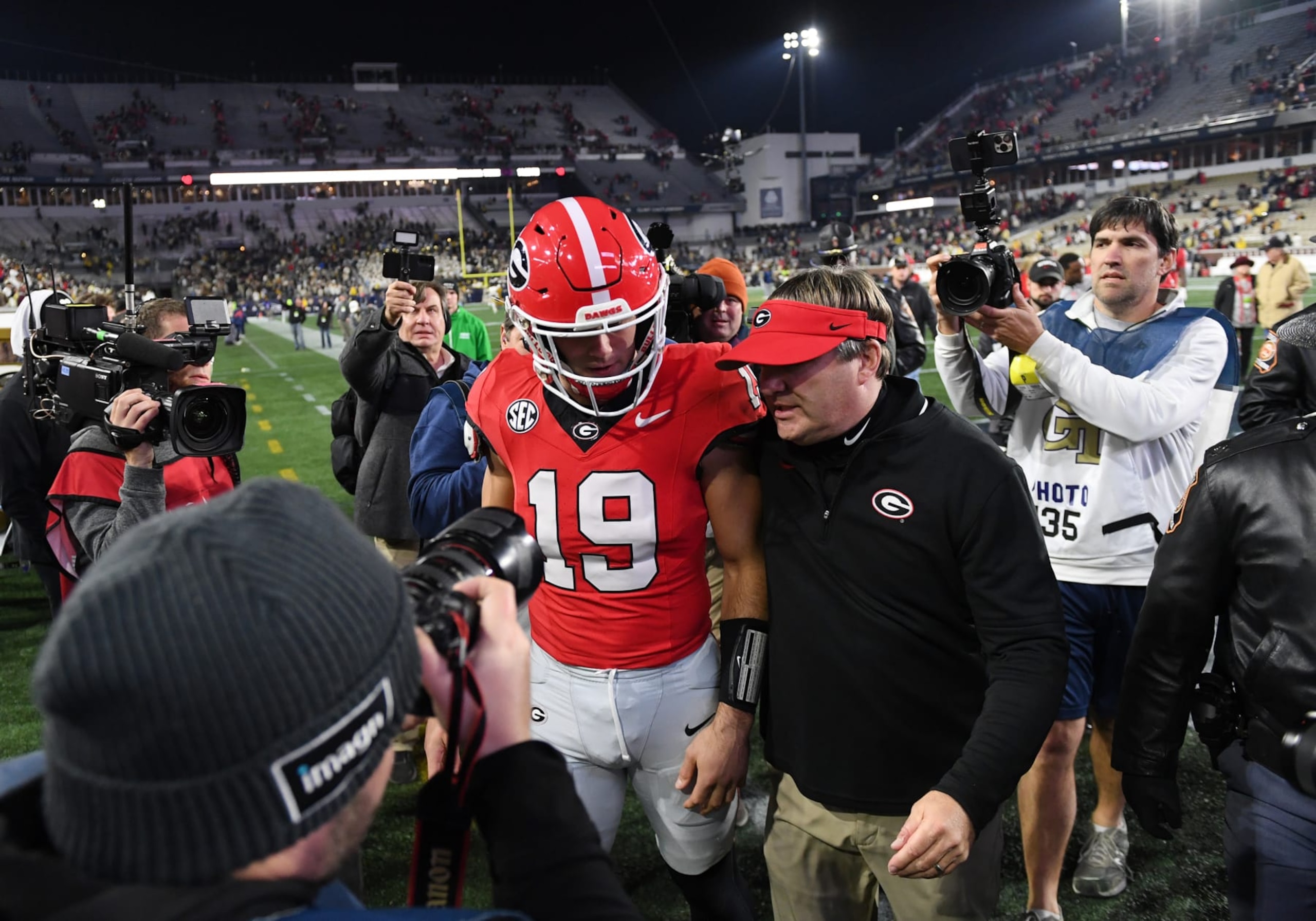 ATLANTA, GA - NOVEMBER 25: Georgia Bulldogs Head Coach Kirby Smart talks to Georgia Bulldogs Tight End Brock Bowers (19) after the college football game between the Georgia Bulldogs and the Georgia Tech Yellow Jackets on November 25, 2023, at Bobby Dodd Stadium in Atlanta, GA. (Photo by Jeffrey Vest/Icon Sportswire via Getty Images)