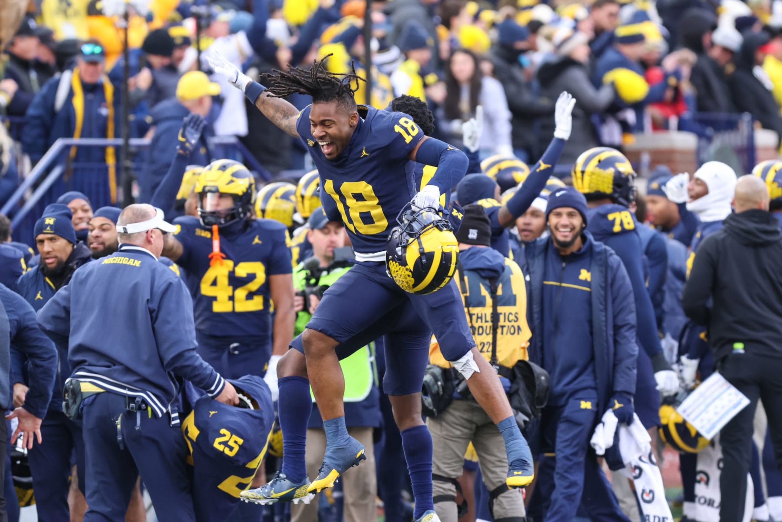 ANN ARBOR, MI - NOVEMBER 25:  Michigan Wolverines defensive back Ja'Den McBurrows (18) celebrates a win with a teammate during a regular season Big Ten Conference college football game between the Ohio State Buckeyes and the Michigan Wolverines on November 25, 2023 at Michigan Stadium in Ann Arbor, Michigan. (Photo by Scott W. Grau/Icon Sportswire via Getty Images)