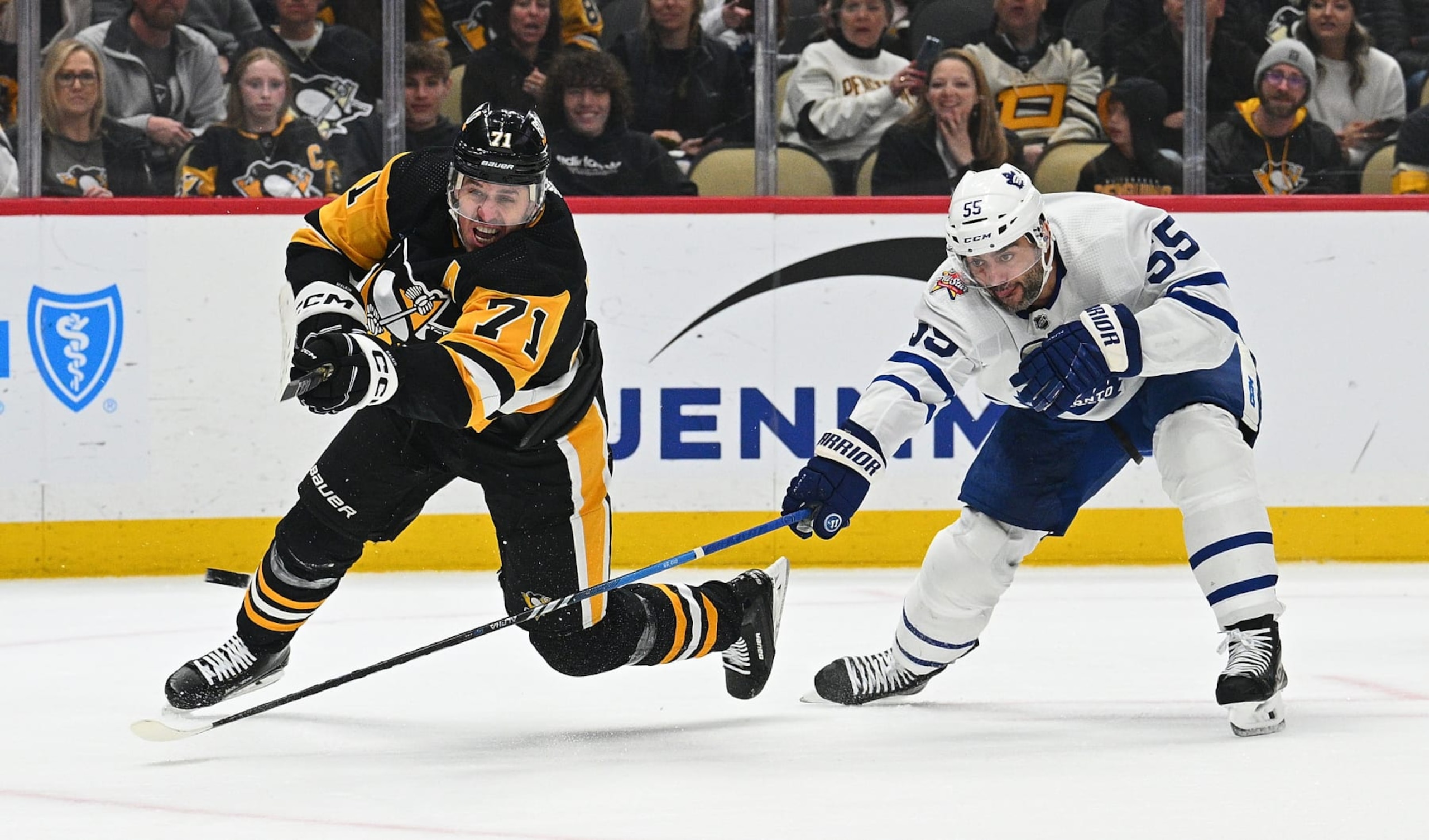 PITTSBURGH, PENNSYLVANIA - NOVEMBER 25: Evgeni Malkin #71 of the Pittsburgh Penguins attempts a shot as Mark Giordano #55 of the Toronto Maple Leafs defends in the first period during the game at PPG PAINTS Arena on November 25, 2023 in Pittsburgh, Pennsylvania. (Photo by Justin Berl/Getty Images)