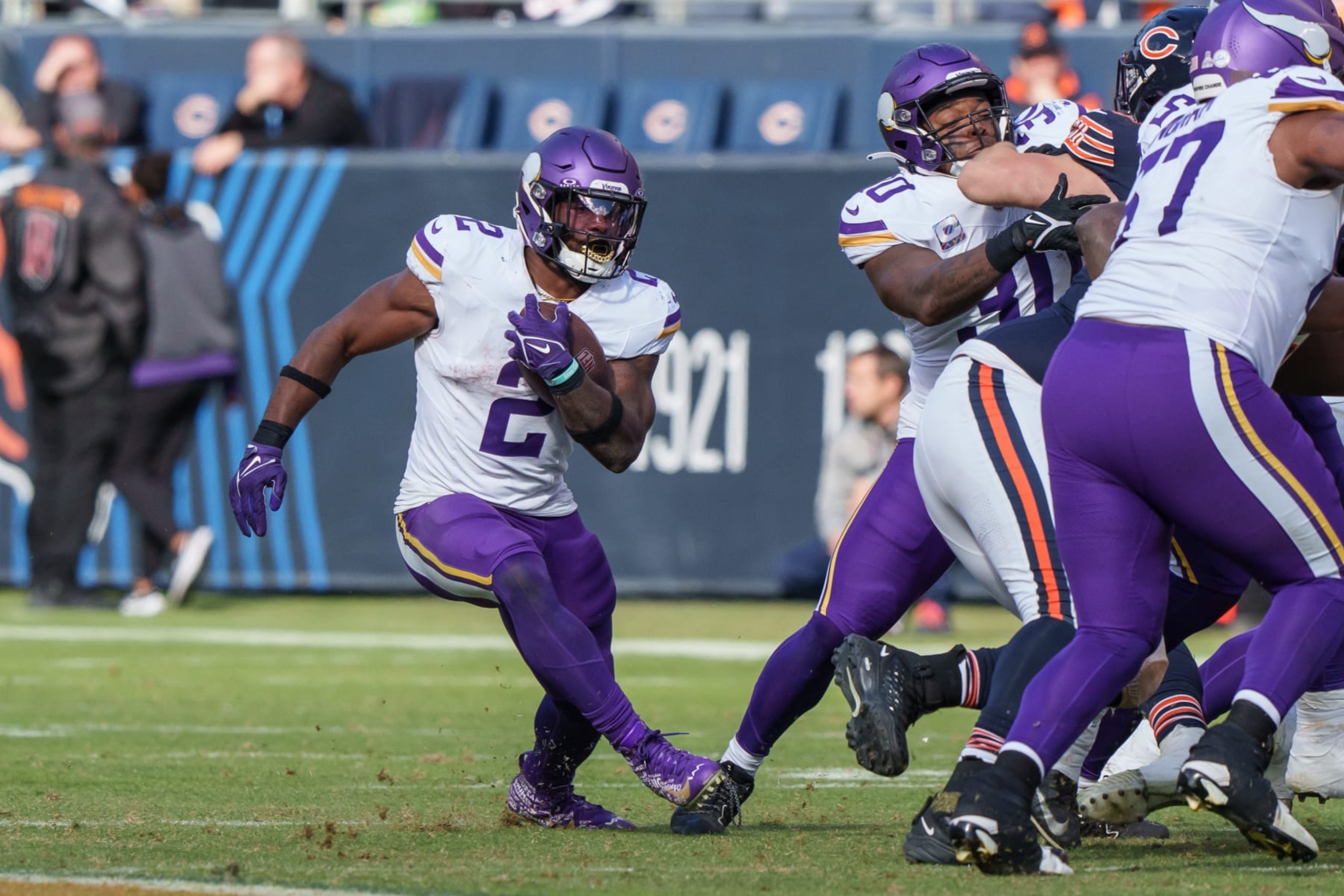 CHICAGO, IL - OCTOBER 15: Running back Alexander Mattison #2 of the Minnesota Vikings runs the ball during the second half of an NFL football game against the Chicago Bears at Soldier Field on October 15, 2023 in Chicago, Illinois. (Photo by Todd Rosenberg/Getty Images)