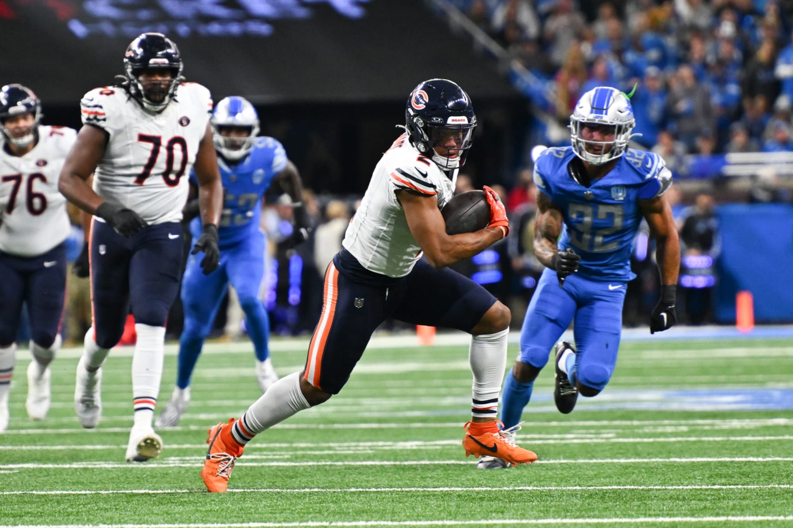 DETROIT, MI - NOVEMBER 19: Chicago Bears wide receiver DJ Moore (2) pulls away from a tackle by Detroit Lions safety Kerby Joseph (31) during the Detroit Lions versus the Chicago Bears game on Sunday November 19, 2023 at Ford Field in Detroit, MI. (Photo by Steven King/Icon Sportswire via Getty Images)