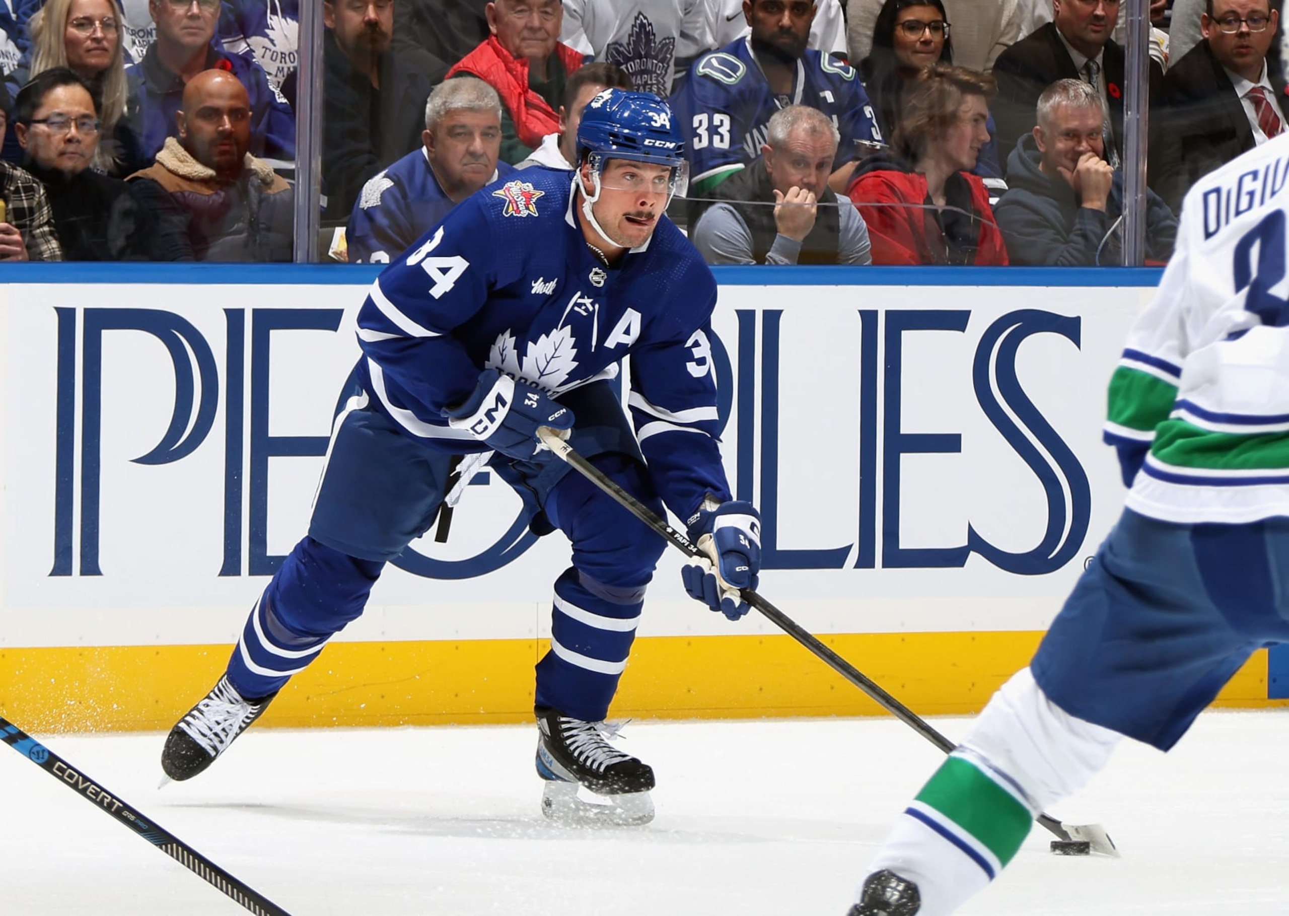 TORONTO, CANADA - NOVEMBER 11: Auston Matthews #34 of the Toronto Maple Leafs skates against the Vancouver Canucks at Scotiabank Arena on November 11, 2023 in Toronto, Ontario, Canada. (Photo by Bruce Bennett/Getty Images)