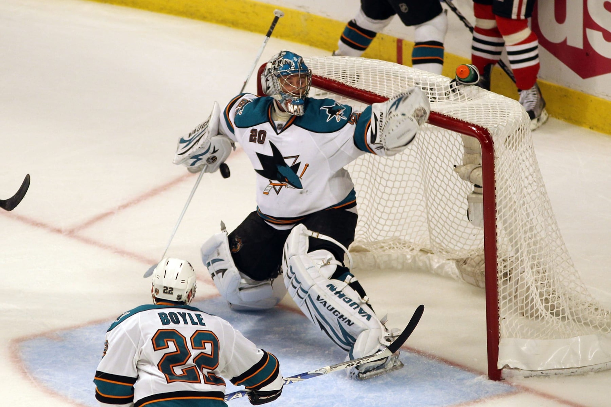 CHICAGO - MAY 21:  Goaltender Evgeni Nabokov #20 of the San Jose Sharks allows the game-winning goal on a shot by Dustin Byfuglien #33 of the Chicago Blackhawks in overtime of Game Three of the Western Conference Finals during the 2010 NHL Stanley Cup Playoffs at the United Center on May 21, 2010 in Chicago, Illinois.  (Photo by Jamie Squire/Getty Images)