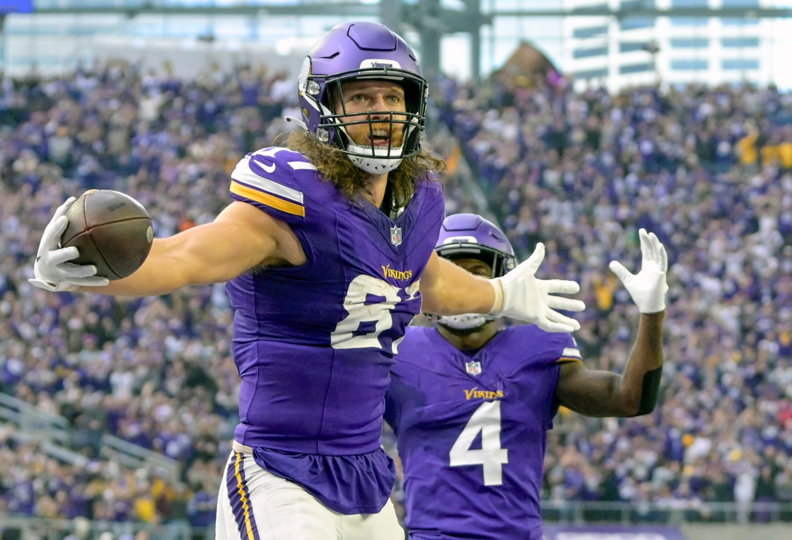 MINNEAPOLIS, MN - NOVEMBER 12: Minnesota Vikings tight end T.J. Hockenson (87) celebrates his 28-yard touchdown reception during the second quarter of an NFL game between the Minnesota Vikings and New Orleans Saints on November 12, 2023, at U.S. Bank Stadium in Minneapolis, MN. (Photo by Nick Wosika/Icon Sportswire via Getty Images)