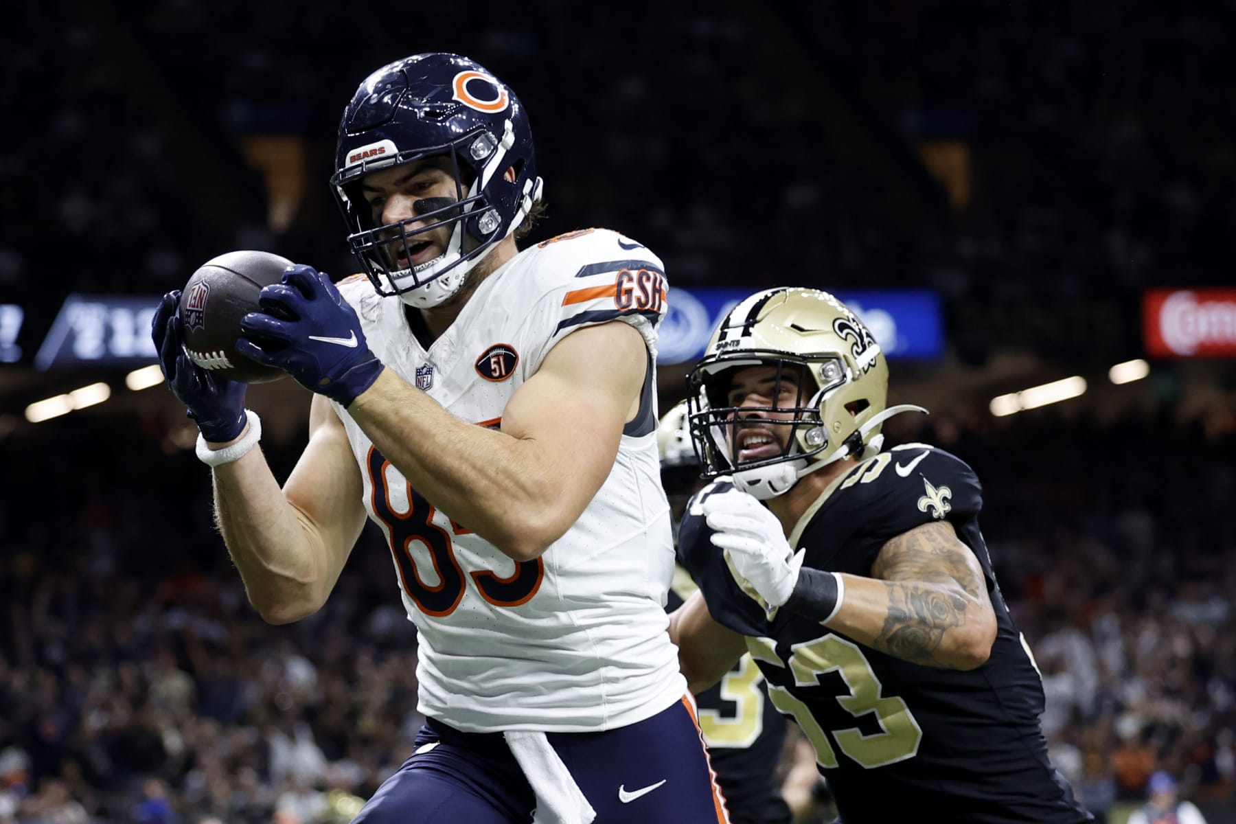 NEW ORLEANS, LOUISIANA - NOVEMBER 05: Cole Kmet #85 of the Chicago Bears catches a pass while defended by Zack Baun #53 of the New Orleans Saints during the first half at Caesars Superdome on November 05, 2023 in New Orleans, Louisiana. (Photo by Wesley Hitt/Getty Images)