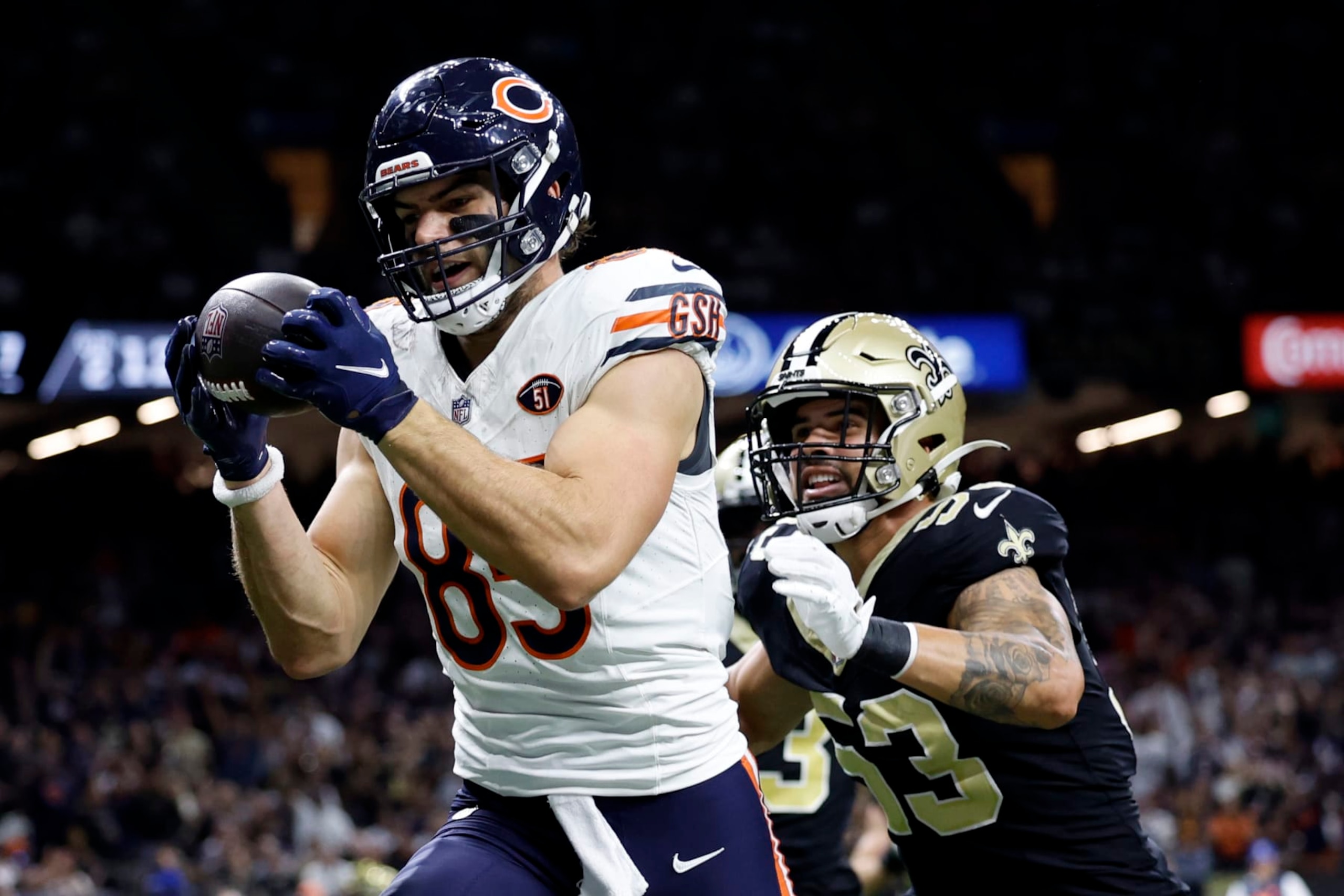 NEW ORLEANS, LOUISIANA - NOVEMBER 05: Cole Kmet #85 of the Chicago Bears catches a pass while defended by Zack Baun #53 of the New Orleans Saints during the first half at Caesars Superdome on November 05, 2023 in New Orleans, Louisiana. (Photo by Wesley Hitt/Getty Images)