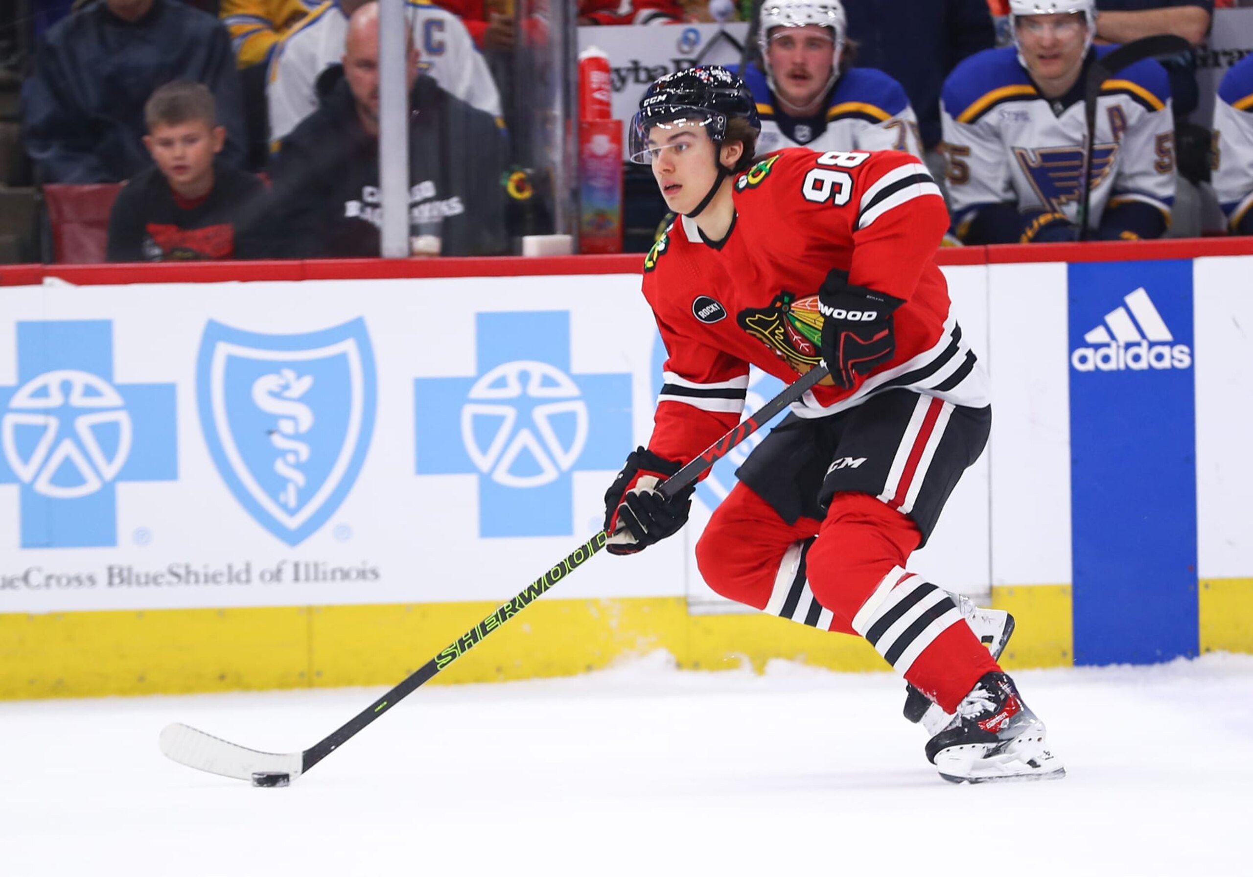 CHICAGO, IL - NOVEMBER 26: CHICAGO, IL - NOVEMBER 26: Connor Bedard #98 of the Chicago Blackhawks brings the puck up ice during the first period against the St. Louis Blues at the United Center on November 26, 2023 in Chicago, Illinois. (Photo by Melissa Tamez/Icon Sportswire via Getty Images)