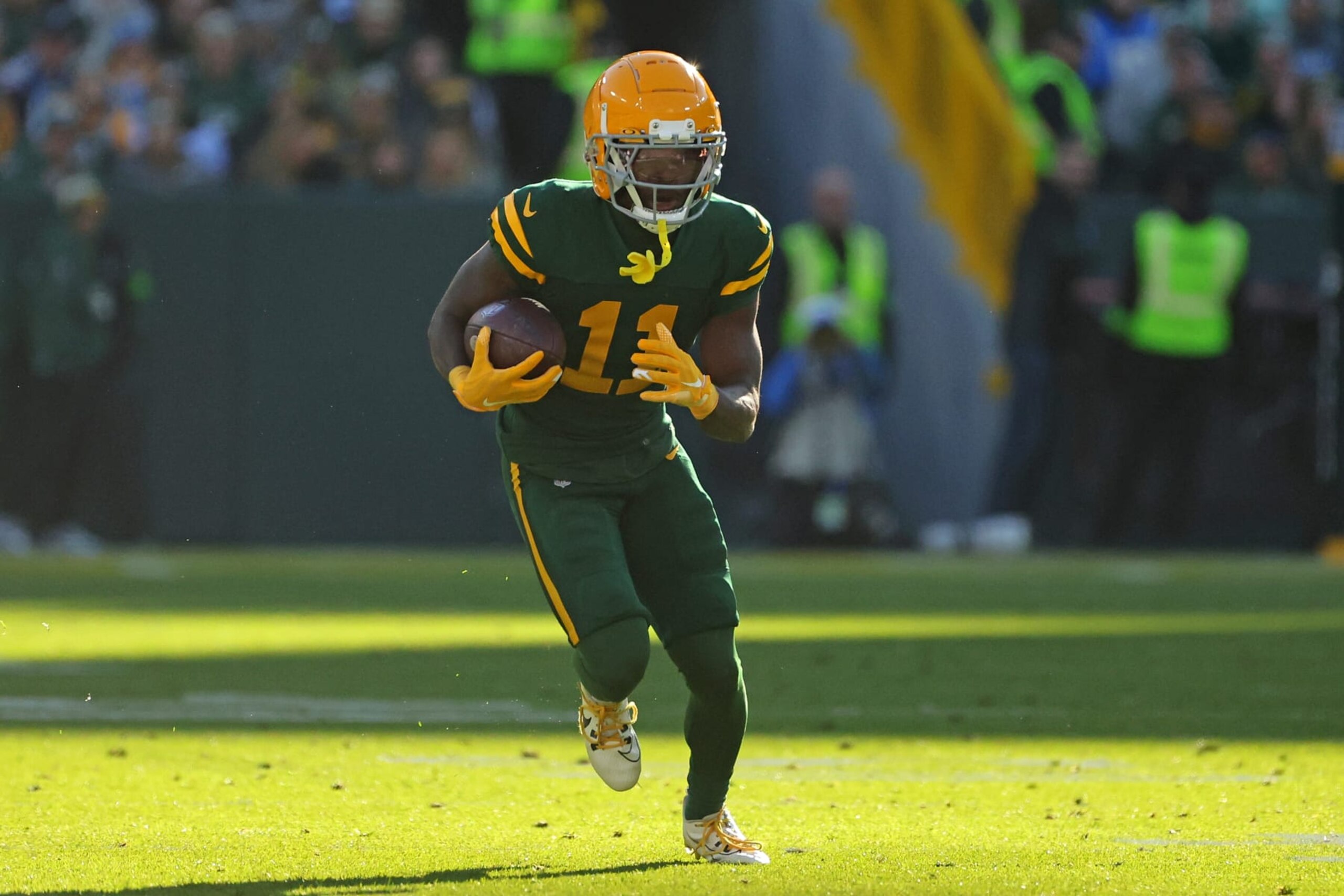 GREEN BAY, WISCONSIN - NOVEMBER 19: Jayden Reed #11 of the Green Bay Packers runs for yards during a game against the Los Angeles Chargers at Lambeau Field on November 19, 2023 in Green Bay, Wisconsin. The Packers defeated the Chargers 23-20. (Photo by Stacy Revere/Getty Images)