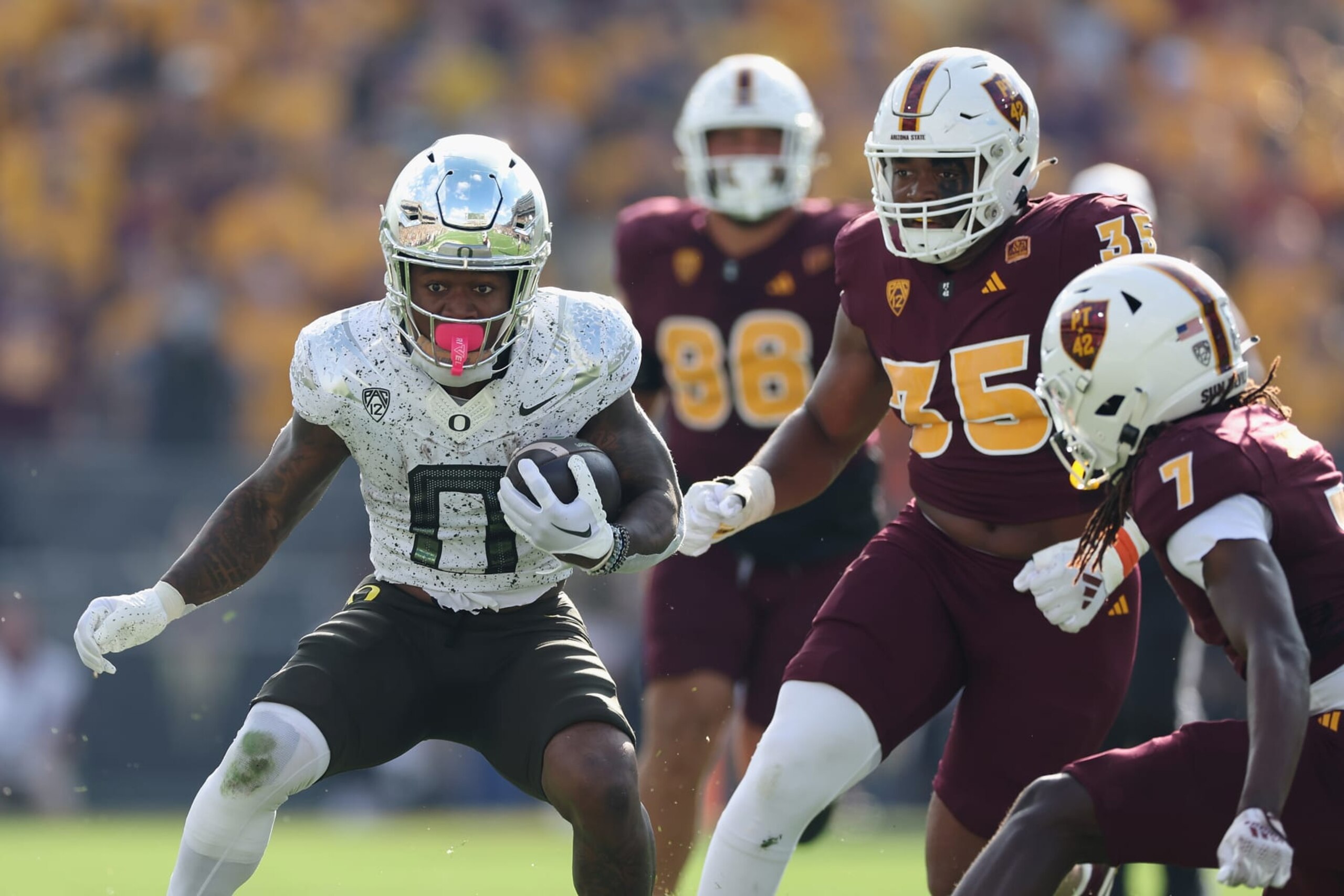 TEMPE, ARIZONA - NOVEMBER 18: Running back Bucky Irving #0 of the Oregon Ducks rushes the football against the Arizona State Sun Devils during the NCAAF game at Mountain America Stadium on November 18, 2023 in Tempe, Arizona. The Ducks defeated the Sun Devils 49-13. (Photo by Christian Petersen/Getty Images)