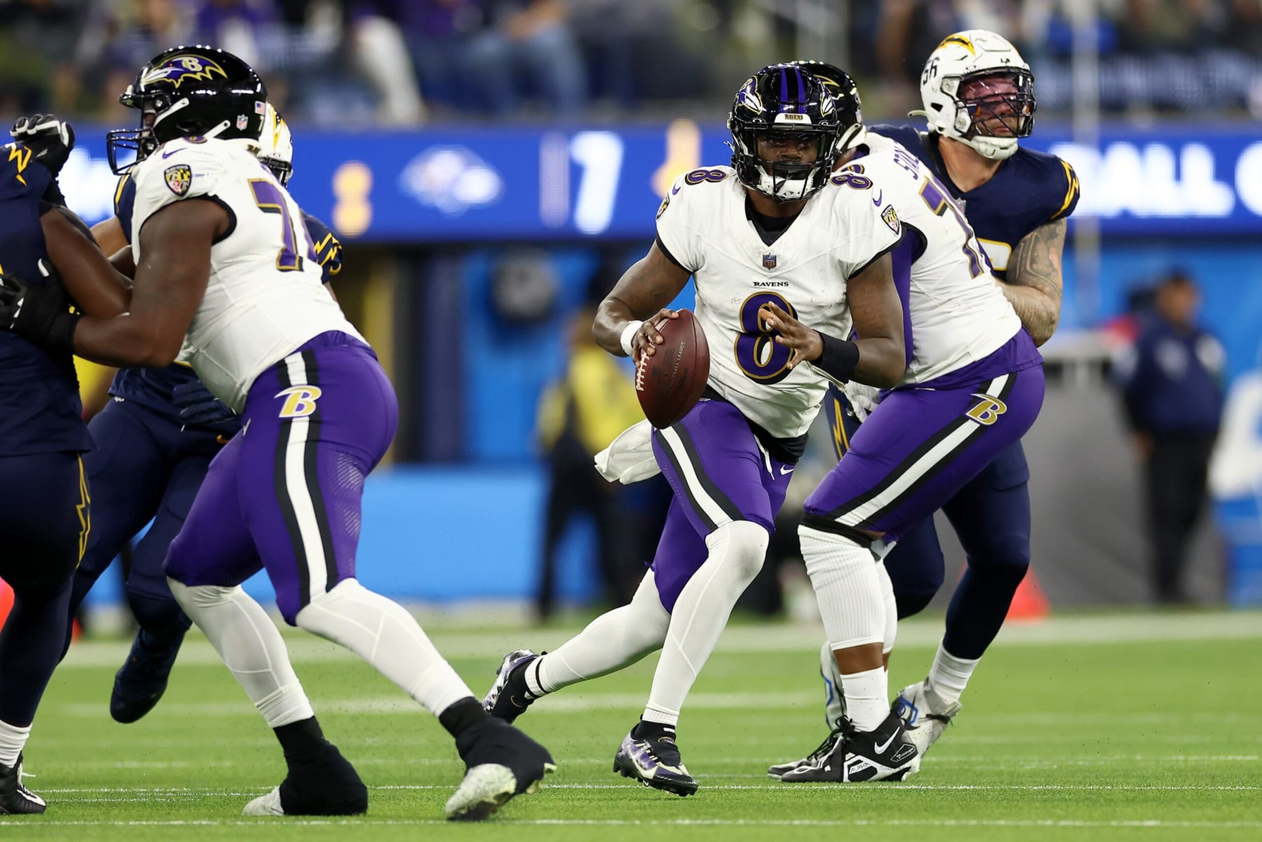 INGLEWOOD, CALIFORNIA - NOVEMBER 26: Lamar Jackson #8 of the Baltimore Ravens scrambles out of the pocket during the second quarter against the Los Angeles Chargers at SoFi Stadium on November 26, 2023 in Inglewood, California. (Photo by Katelyn Mulcahy/Getty Images)