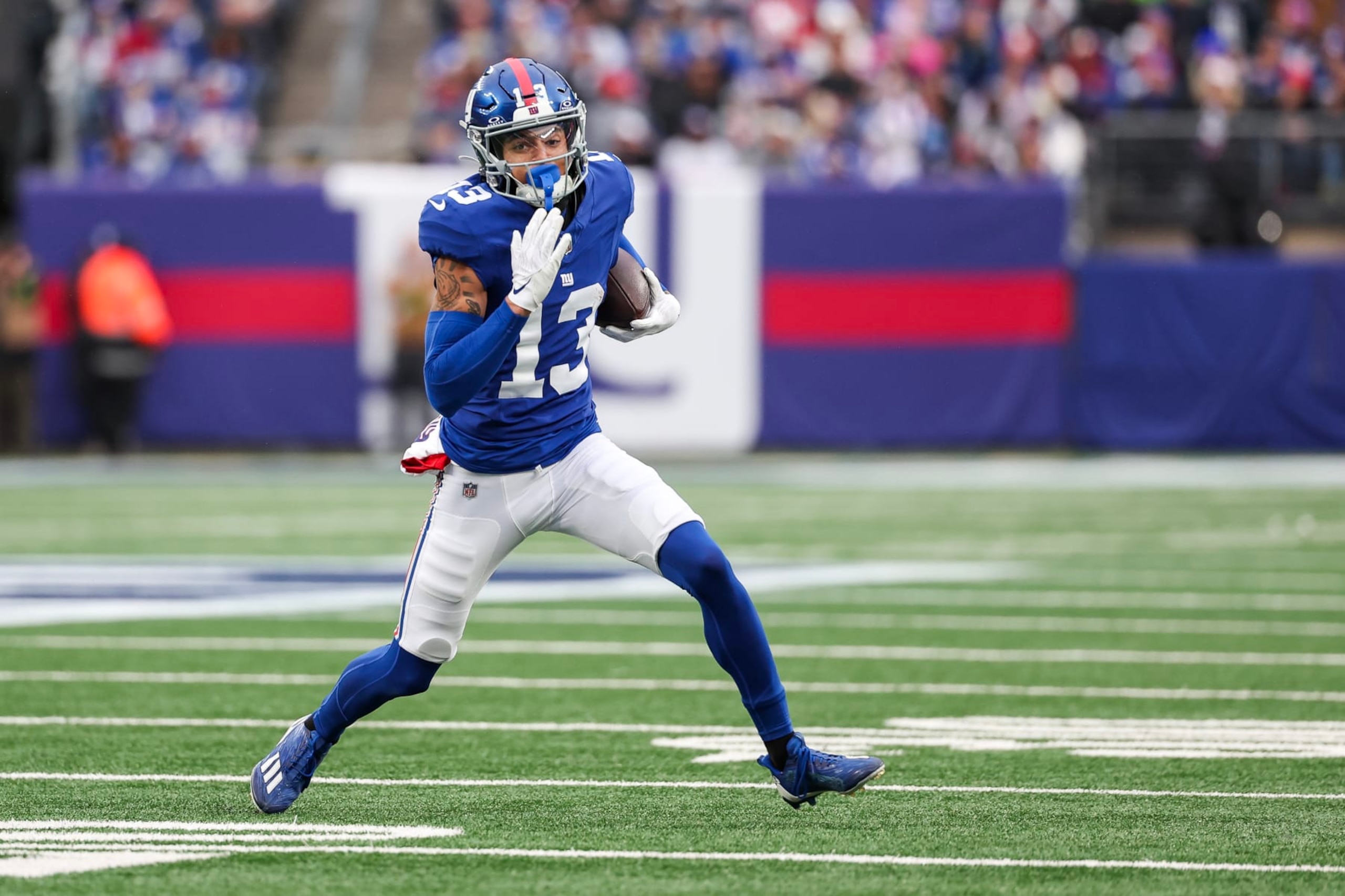 EAST RUTHERFORD, NEW JERSEY - NOVEMBER 26: Jalin Hyatt #13 of the New York Giants runs after a catch during the second quarter against the New England Patriots at MetLife Stadium on November 26, 2023 in East Rutherford, New Jersey. (Photo by Al Bello/Getty Images)