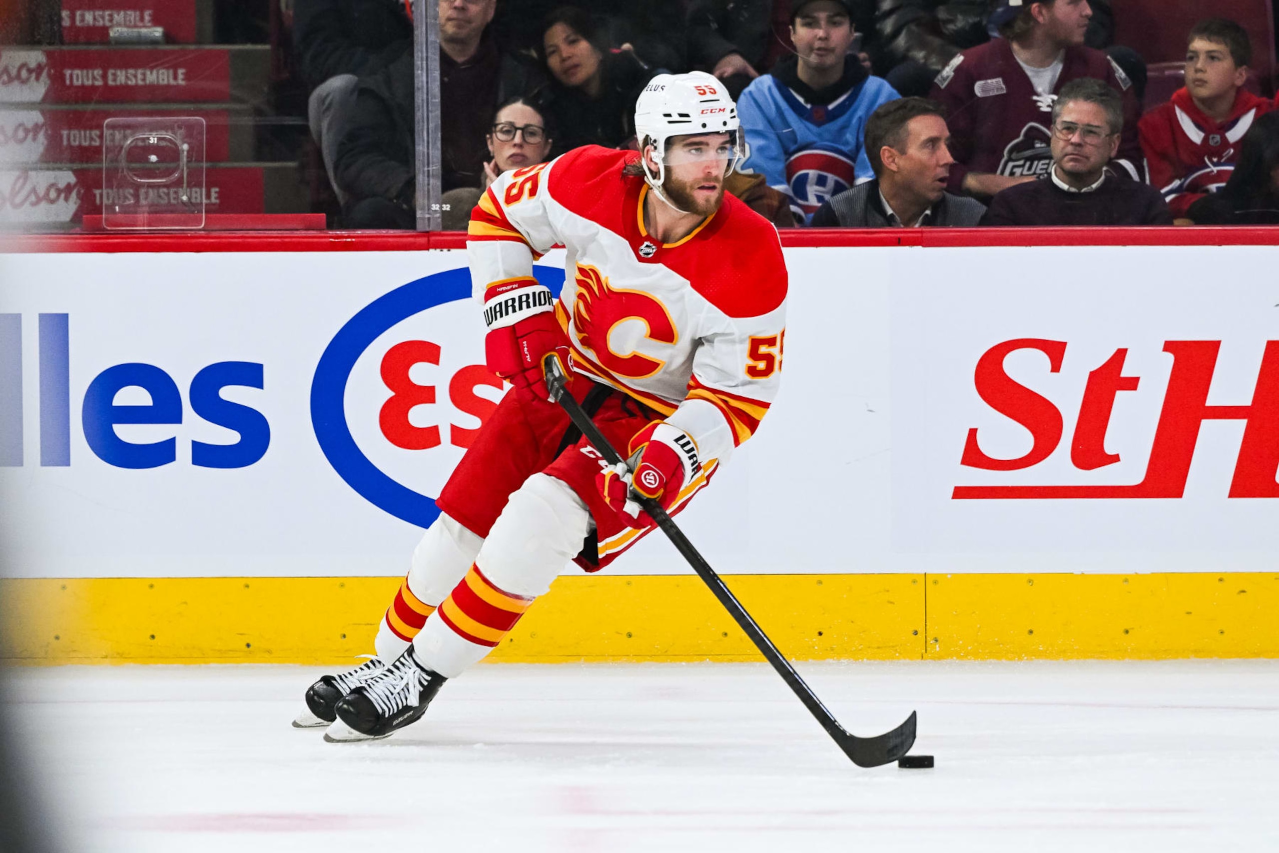 MONTREAL, QC - NOVEMBER 14: Calgary Flames defenseman Noah Hanifin (55) plays the puck during the Calgary Flames versus the Montreal Canadiens game on November 14, 2023, at Bell Centre in Montreal, QC (Photo by David Kirouac/Icon Sportswire via Getty Images)