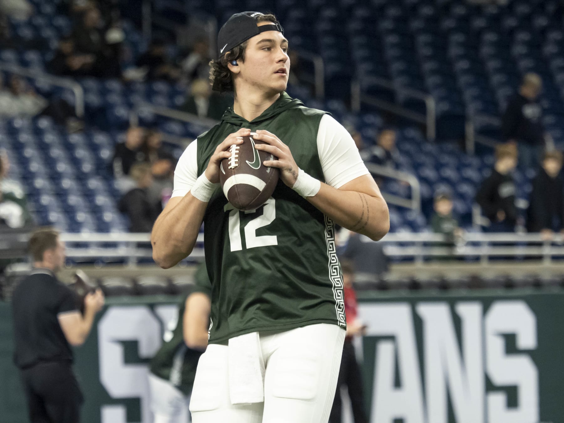 DETROIT, MI - NOVEMBER 24: Michigan State Spartans quarterback Katin Houser (12) warms up before a college football game between the Penn State Nittany Lions and the Michigan State Spartans on November 24, 2023 at Ford Field in Detroit, Michigan. (Photo by Joseph Weiser/Icon Sportswire via Getty Images)
