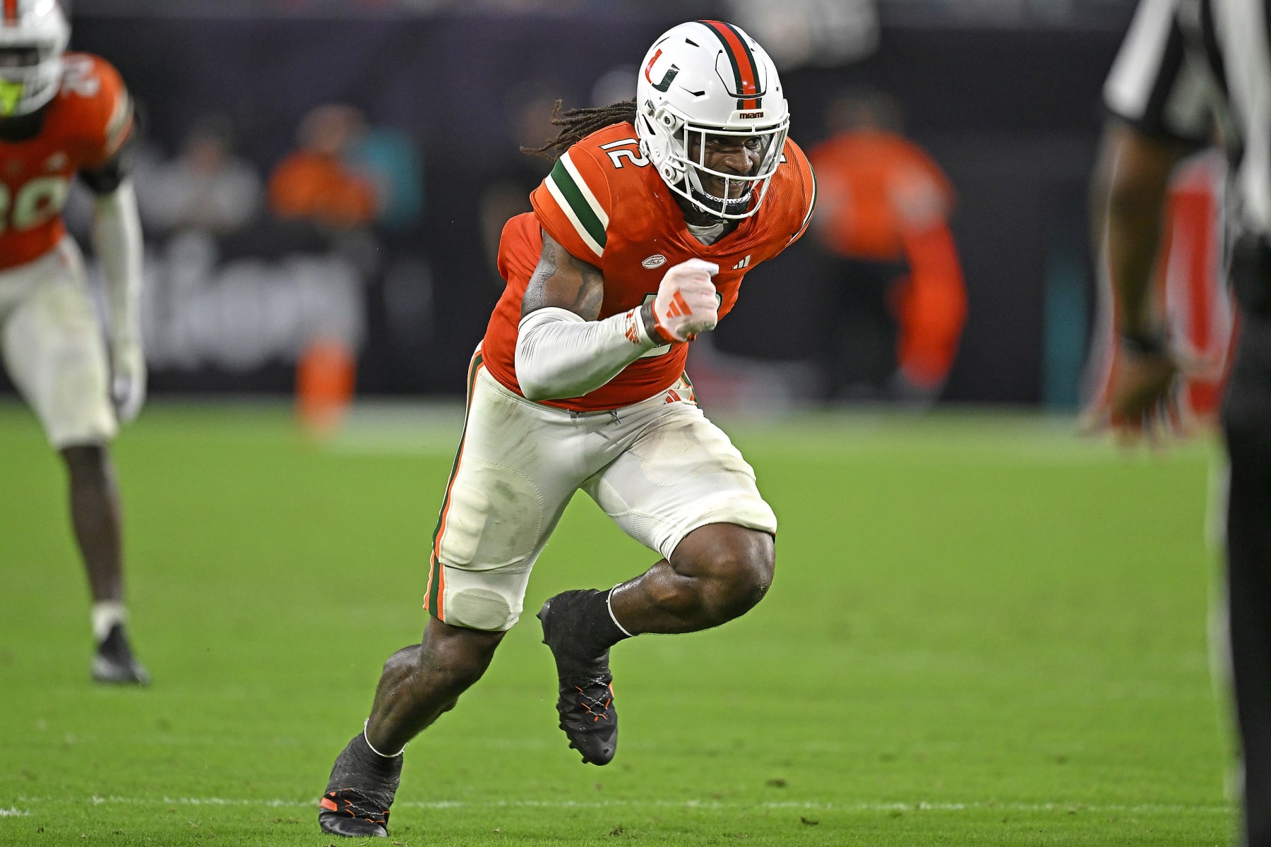 MIAMI GARDENS, FL - SEPTEMBER 09:  Miami defensive lineman Jahfari Harvey (12) pursues the ball carrier in the fourth quarter as the Miami Hurricanes faced the Texas A&M Aggies on September 9, 2023, at Hard Rock Stadium in Miami Gardens, Florida. (Photo by Samuel Lewis/Icon Sportswire via Getty Images)