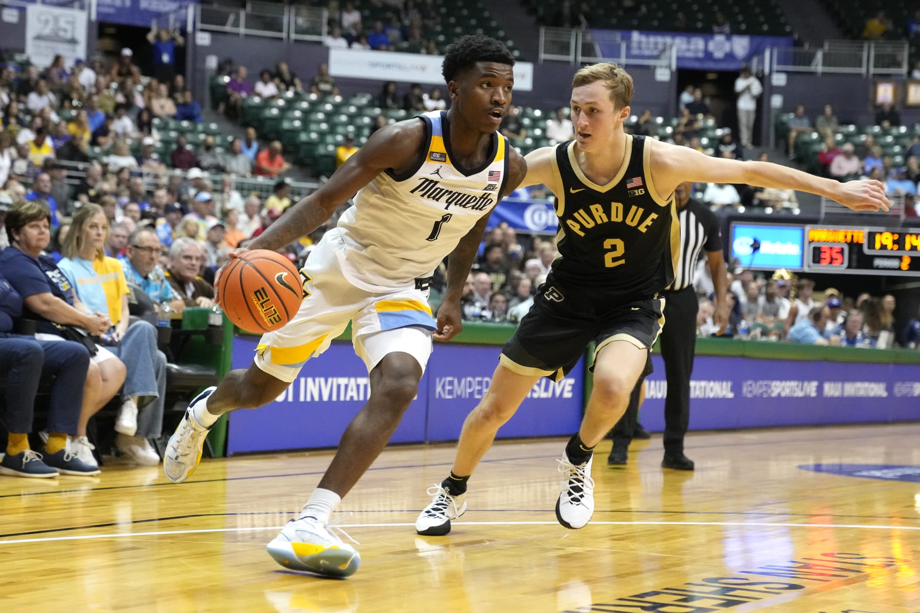 Marquette's Kam Jones and Purdue's Fletcher Loyer