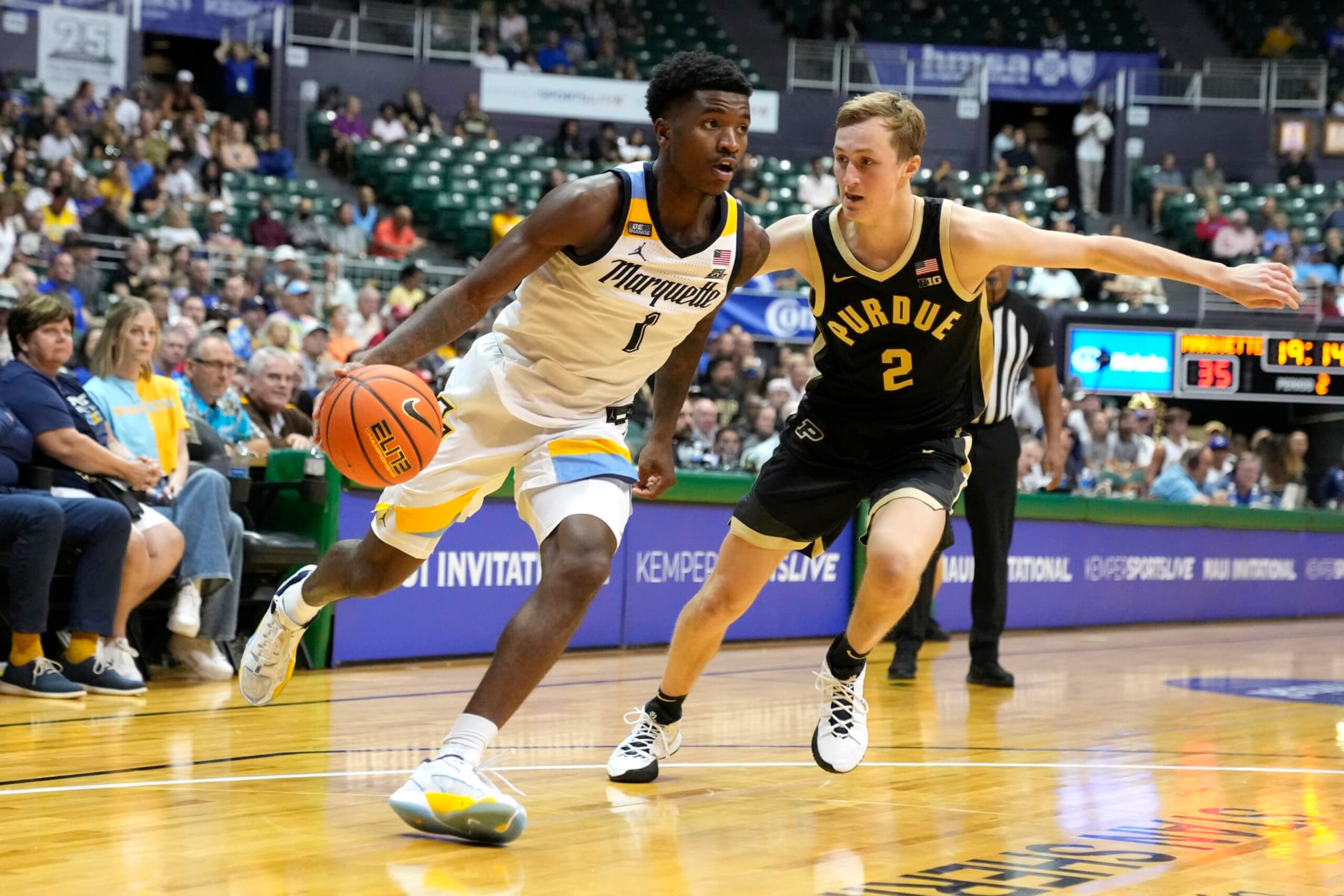 Marquette's Kam Jones and Purdue's Fletcher Loyer