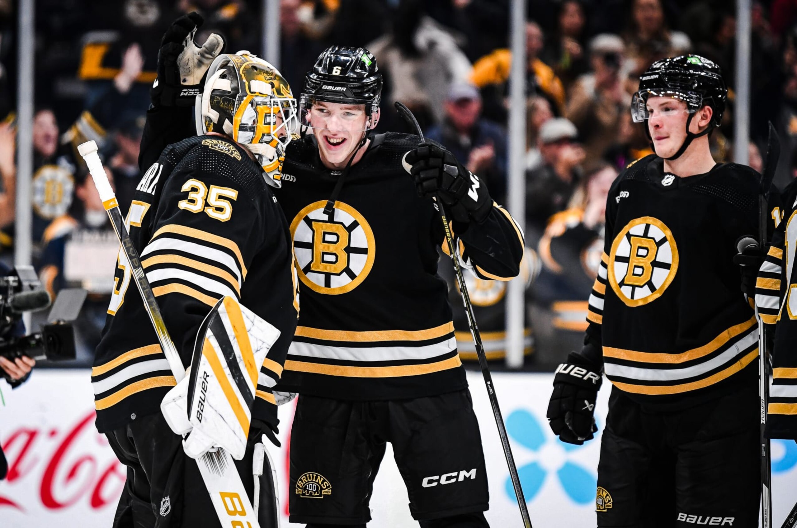 Linus Ullmark (left) and Mason Lohrei (center) celebrate a win. Linus Ullmark (left) and Mason Lohrei (center) celebrate a win.