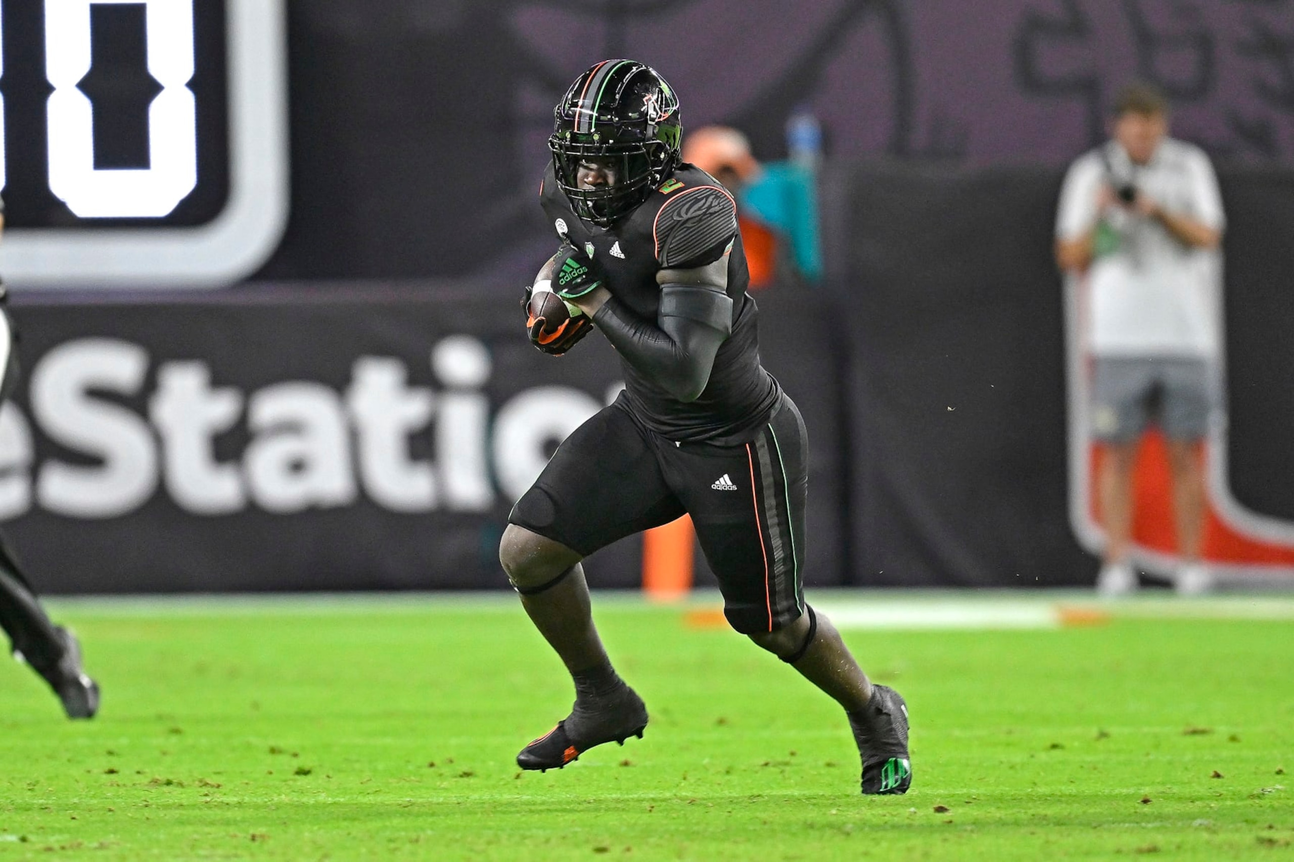 MIAMI GARDENS, FL - OCTOBER 07:  Miami running back Donald Chaney, Jr. (2) carries the ball in the second quarter as the Miami Hurricanes faced the Georgia Tech Yellow Jackets on October 7, 2023, at Hard Rock Stadium in Miami Gardens, Florida. (Photo by Samuel Lewis/Icon Sportswire via Getty Images)