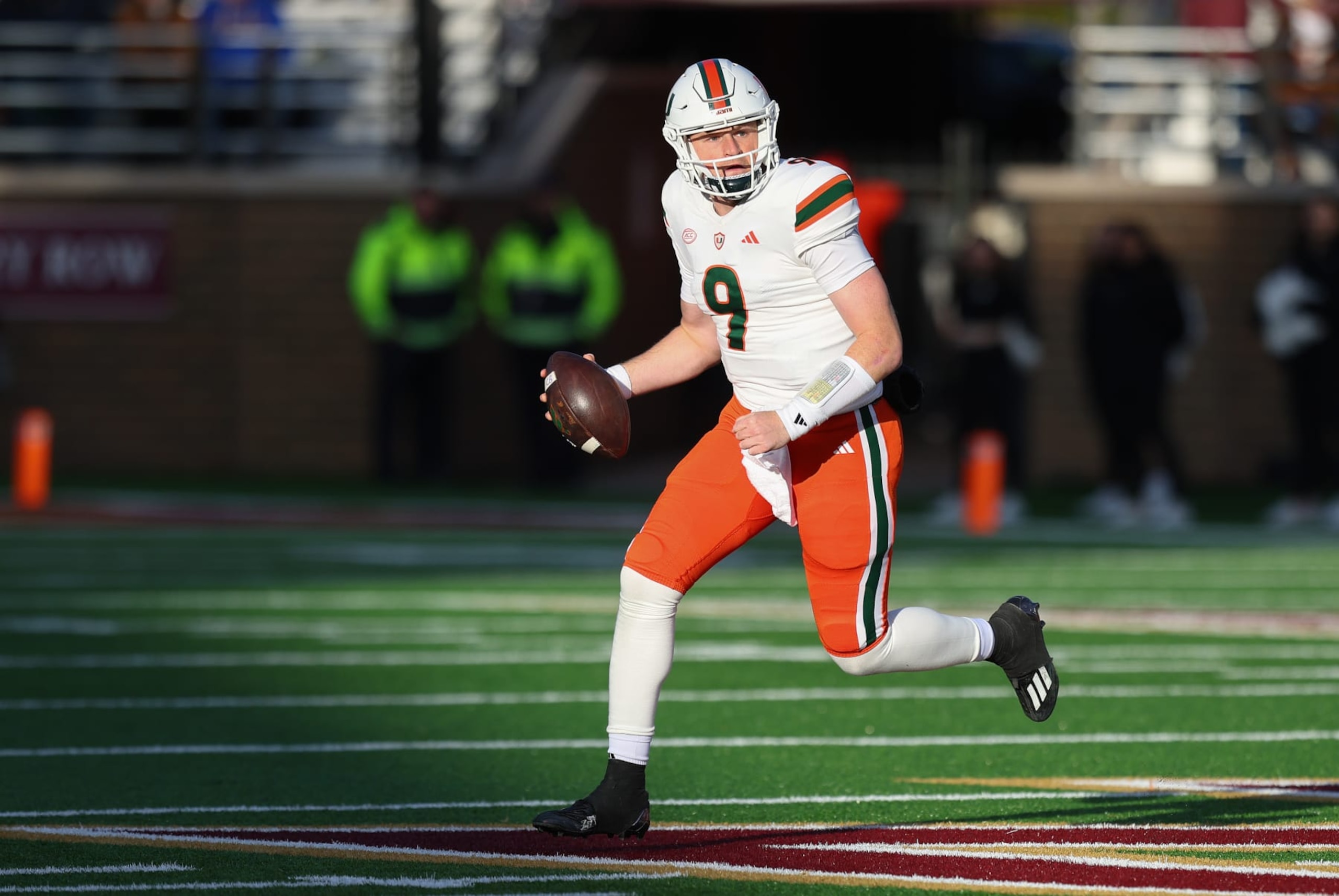 CHESTNUT HILL, MA - NOVEMBER 24: Miami Hurricanes quarterback Tyler Van Dyke (9) scrambles during the college football game between Miami Hurricanes and Boston College Eagles on November 24, 2023, at Alumni Stadium in Chestnut Hill, MA. (Photo by M. Anthony Nesmith/Icon Sportswire via Getty Images)