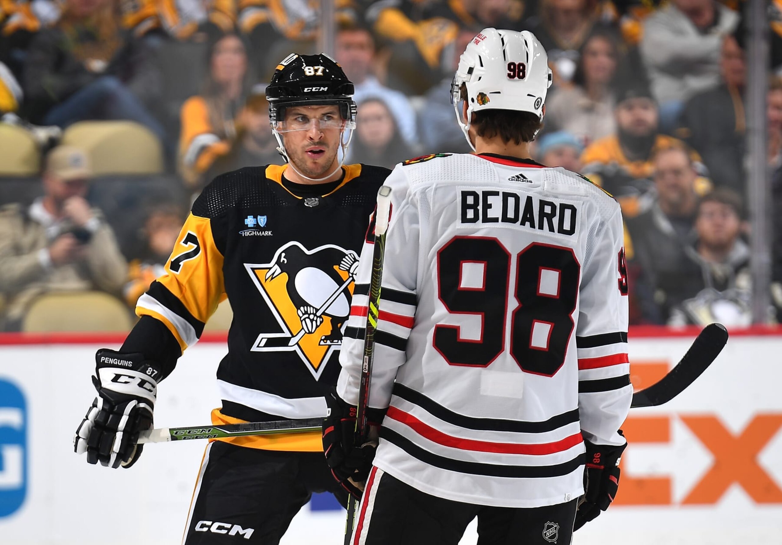 PITTSBURGH, PA - OCTOBER 10:  Sidney Crosby #87 of the Pittsburgh Penguins and Connor Bedard #98 of the Chicago Blackhawks prepare for a face-off at PPG PAINTS Arena on October 10, 2023 in Pittsburgh, Pennsylvania. (Photo by Joe Sargent/NHLI via Getty Images)