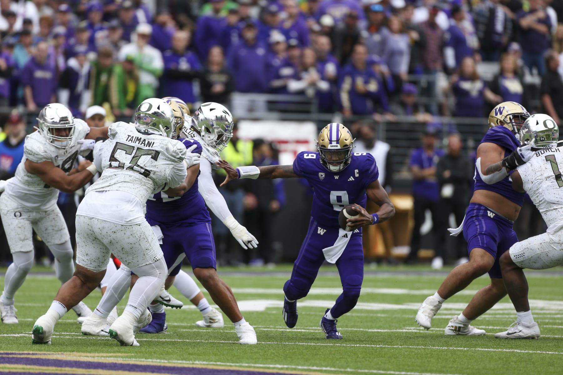 SEATTLE, WA - OCTOBER 14:  Washington (QB) #9 Michael Penix jr races through a hole during the college football game between the Washington Huskies and the Oregon Ducks on October 14, 2023, at Husky Stadium in Seattle, WA. (Photo by Jesse Beals/Icon Sportswire via Getty Images)