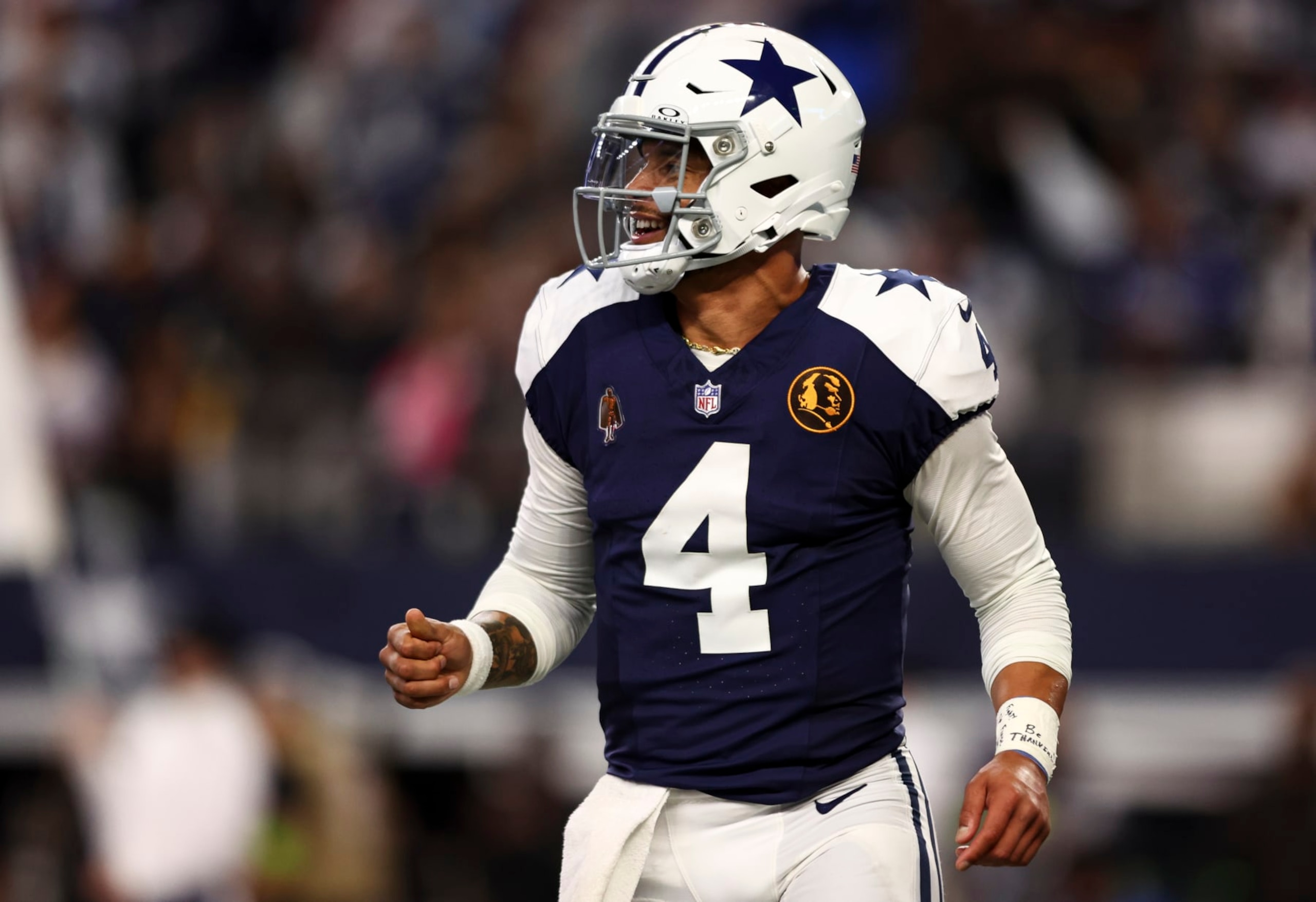 ARLINGTON, TX - NOVEMBER 23: Dak Prescott #4 of the Dallas Cowboys celebrates after a two-point conversion during an NFL football game against the Washington Commanders at AT&T Stadium on November 23, 2023 in Arlington, Texas. (Photo by Kevin Sabitus/Getty Images)