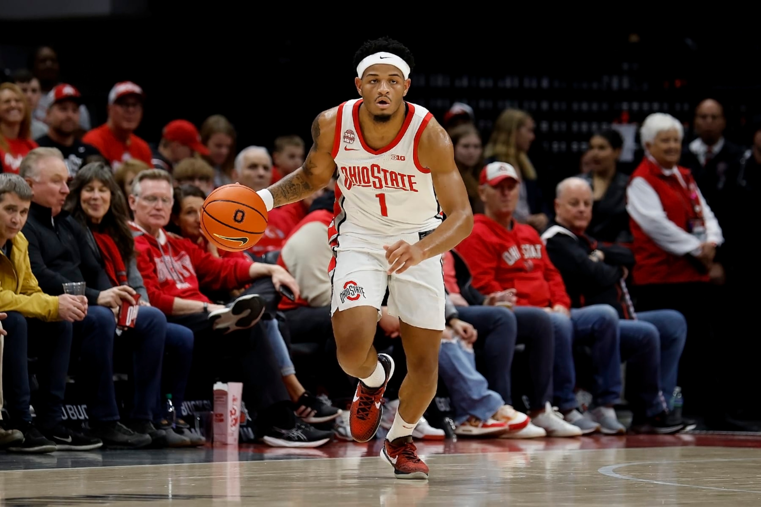COLUMBUS, OHIO - NOVEMBER 10:  Roddy Gayle Jr. #1 of the Ohio State Buckeyes moves the ball up the court during the game against the Texas A&M Aggies at Value City Arena on November 10, 2023 in Columbus, Ohio. (Photo by Kirk Irwin/Getty Images)