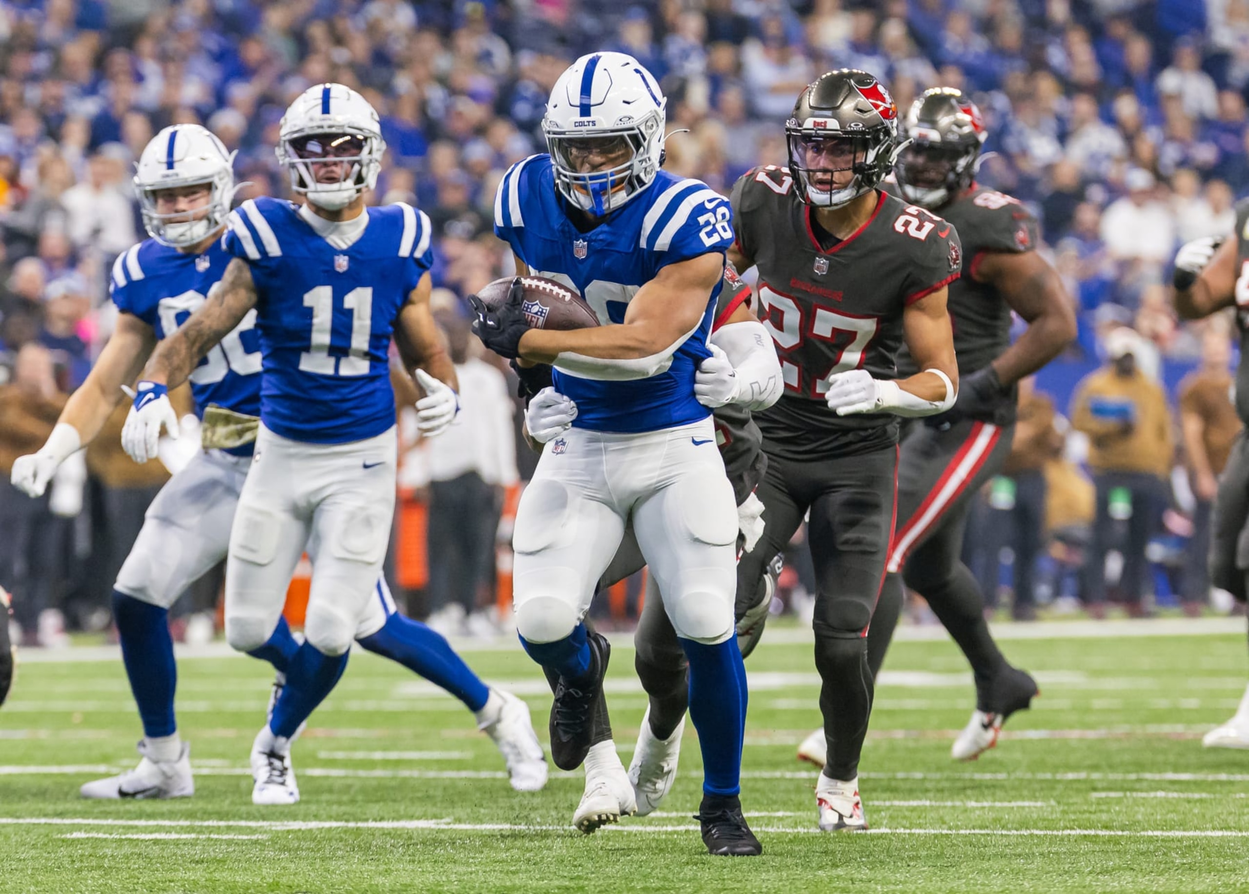 INDIANAPOLIS, INDIANA - NOVEMBER 26: Jonathan Taylor #28 of the Indianapolis Colts runs the ball during the game against the Tampa Bay Buccaneers at Lucas Oil Stadium on November 26, 2023 in Indianapolis, Indiana. (Photo by Michael Hickey/Getty Images)
