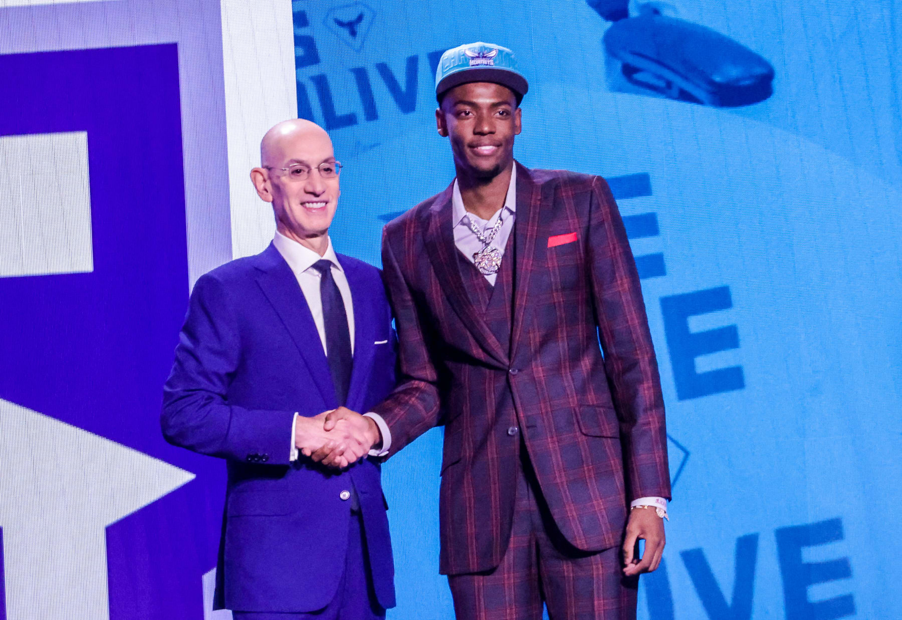 NEW YORK, UNITED STATES - JUNE 22: Brandon Miller (R) shakes hands with NBA Commissioner Adam Silver after being selected number two overall by the Charlotte Hornets at Barclays Center in Brooklyn, New York City on June 22, 2023. (Photo by Selcuk Acar/Anadolu Agency via Getty Images)