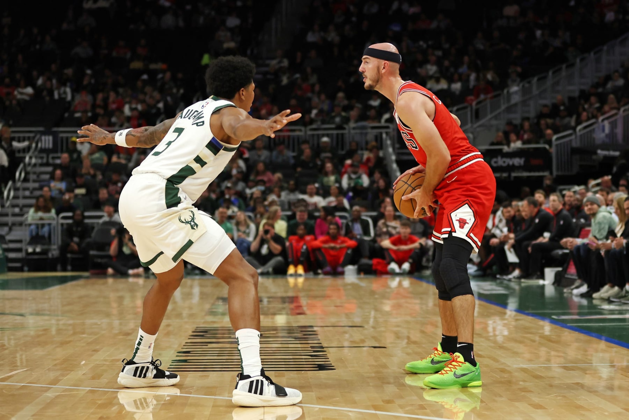 MILWAUKEE, WISCONSIN - OCTOBER 08: Alex Caruso #6 of the Chicago Bulls is defended by MarJon Beauchamp #3 of the Milwaukee Bucks during a preseason game at Fiserv Forum on October 08, 2023 in Milwaukee, Wisconsin. NOTE TO USER: User expressly acknowledges and agrees that, by downloading and or using this photograph, User is consenting to the terms and conditions of the Getty Images License Agreement. (Photo by Stacy Revere/Getty Images)