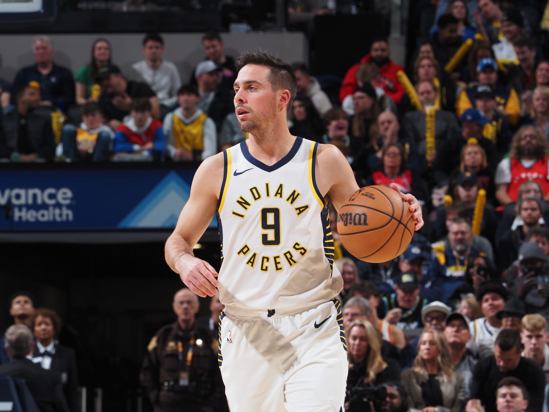 INDIANAPOLIS, IN - NOVEMBER 22: T.J. McConnell #9 of the Indiana Pacers dribbles the ball during the game against the Toronto Raptors on November 22, 2023 at Gainbridge Fieldhouse in Indianapolis, Indiana. NOTE TO USER: User expressly acknowledges and agrees that, by downloading and or using this Photograph, user is consenting to the terms and conditions of the Getty Images License Agreement. Mandatory Copyright Notice: Copyright 2023 NBAE (Photo by Ron Hoskins/NBAE via Getty Images)