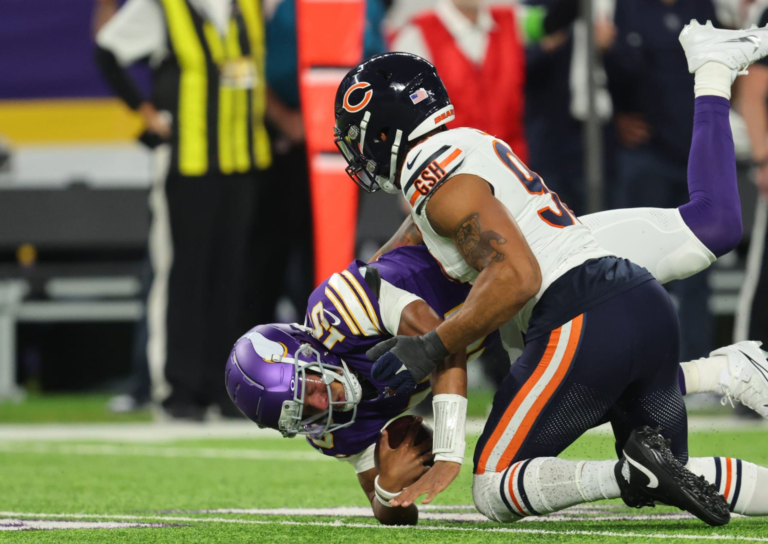 MINNEAPOLIS, MINNESOTA - NOVEMBER 27: Montez Sweat #98 of the Chicago Bears sacks Joshua Dobbs #15 of the Minnesota Vikings during the first quarter at U.S. Bank Stadium on November 27, 2023 in Minneapolis, Minnesota. (Photo by Adam Bettcher/Getty Images)