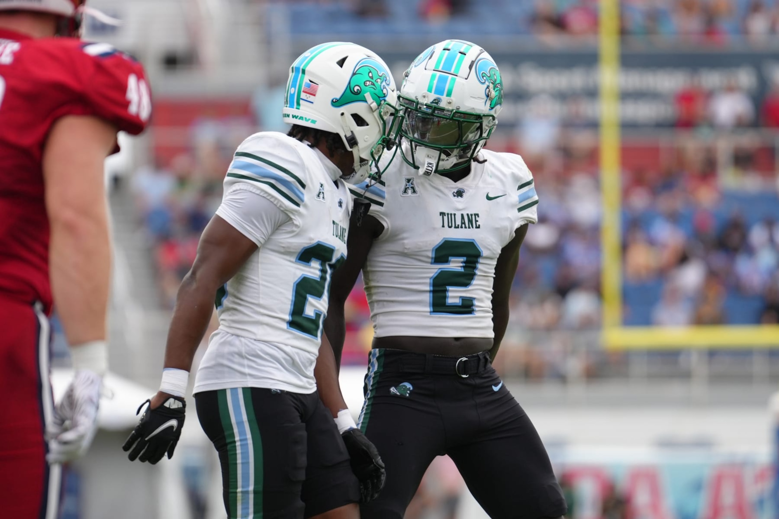 BOCA RATON, FL - NOVEMBER 18: Tulane Green Wave defensive back Jarius Monroe (2) and Tulane Green Wave defensive back Kentrell Webb (29) celebrates after a goal line stop in the first half during the game between the Tulane Green Wave and the Florida Atlantic Owls on Saturday, November 18, 2023 at FAU Stadium, Boca Raton, Fla. (Photo by Peter Joneleit/Icon Sportswire via Getty Images)