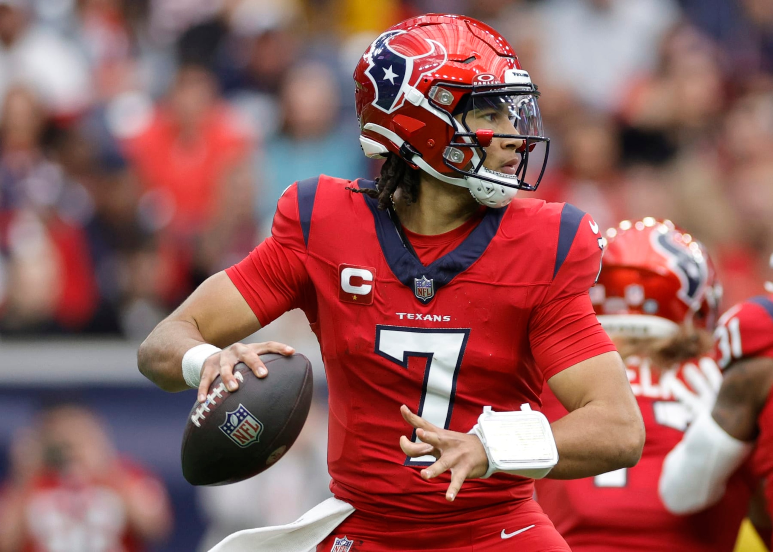 HOUSTON, TEXAS - NOVEMBER 26: C.J. Stroud #7 of the Houston Texans in action against the Jacksonville Jaguars at NRG Stadium on November 26, 2023 in Houston, Texas. (Photo by Carmen Mandato/Getty Images)