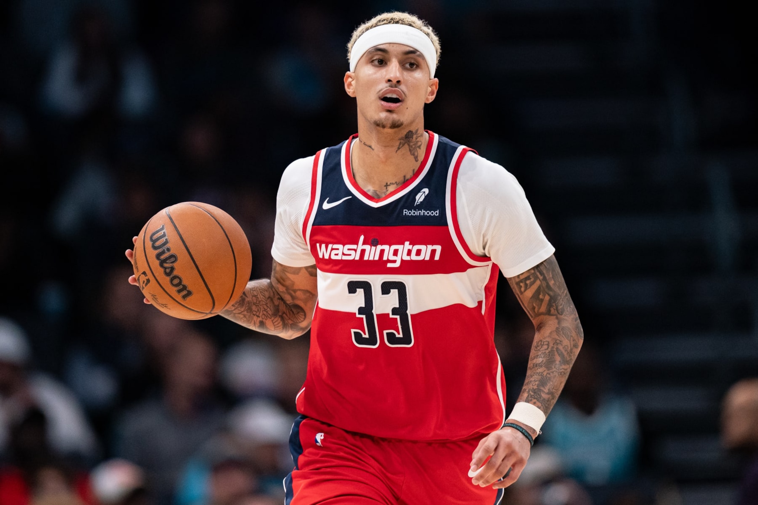 CHARLOTTE, NORTH CAROLINA - NOVEMBER 22: Kyle Kuzma #33 of the Washington Wizards brings the ball up court against the Charlotte Hornets during their game at Spectrum Center on November 22, 2023 in Charlotte, North Carolina. NOTE TO USER: User expressly acknowledges and agrees that, by downloading and or using this photograph, User is consenting to the terms and conditions of the Getty Images License Agreement. (Photo by Jacob Kupferman/Getty Images)